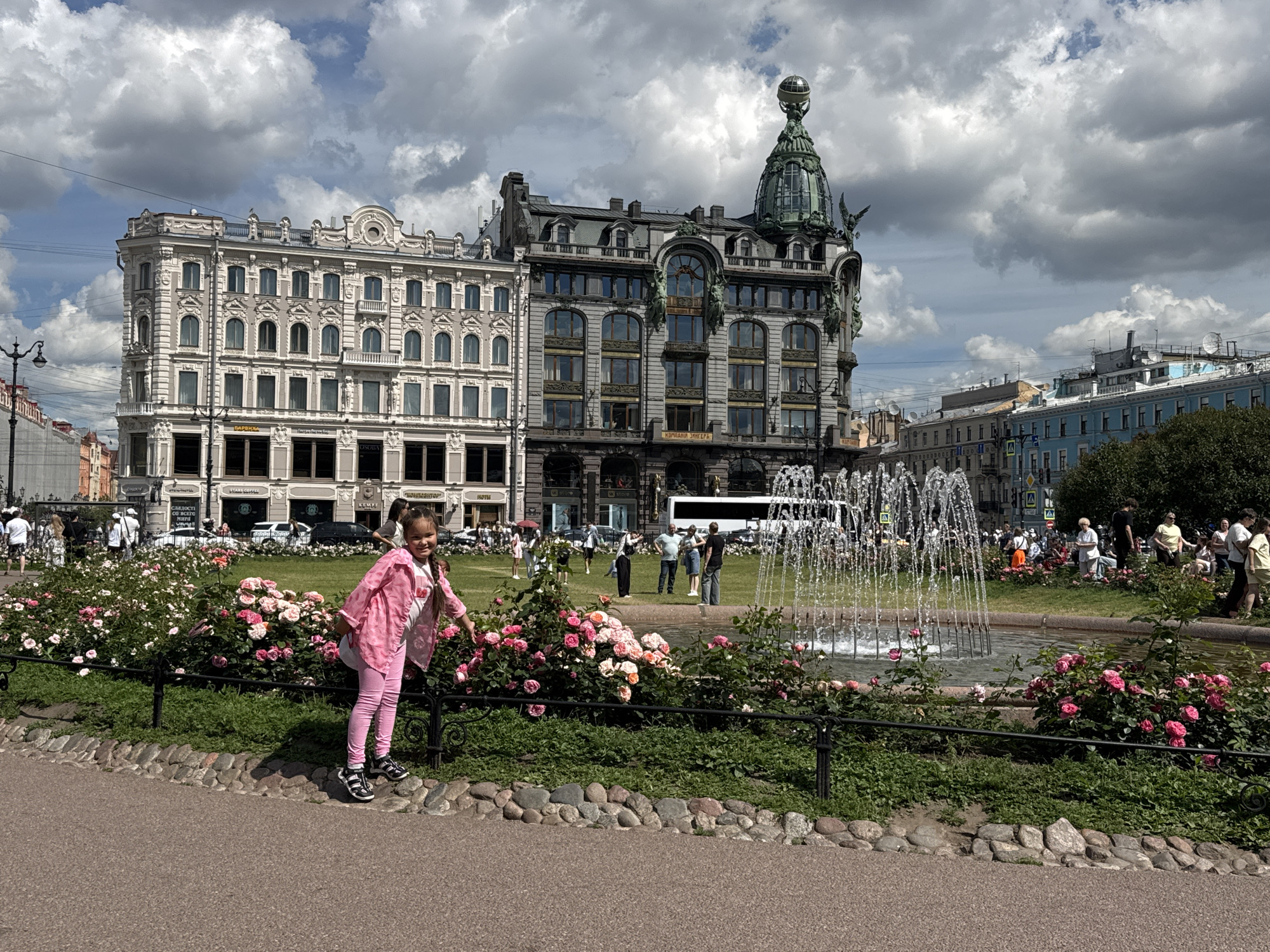 Sunny morning at Singer House and Nevsky Prospekt fountain gardens