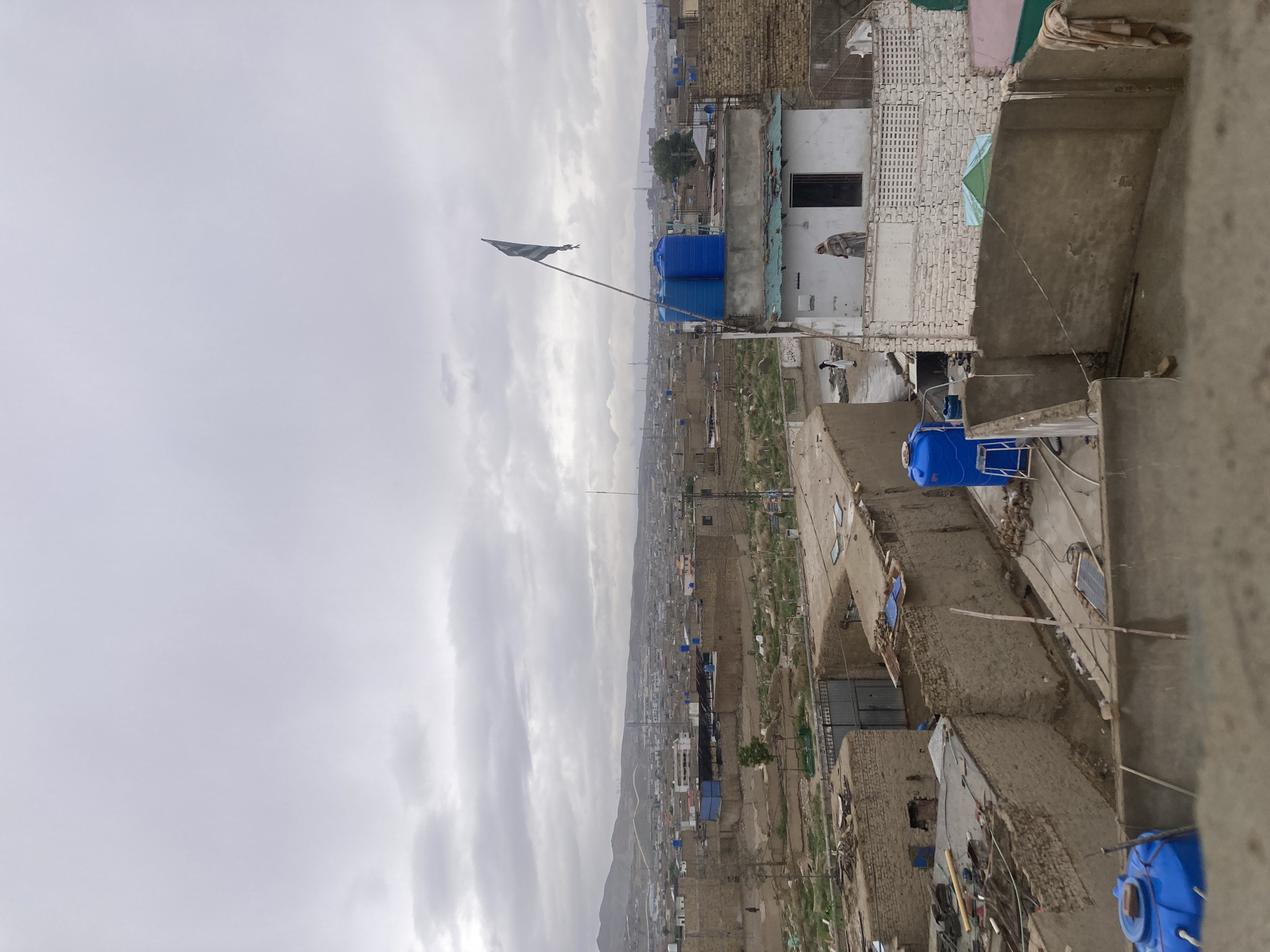 Elevated views capture Quetta cityscape with mountains backdrop