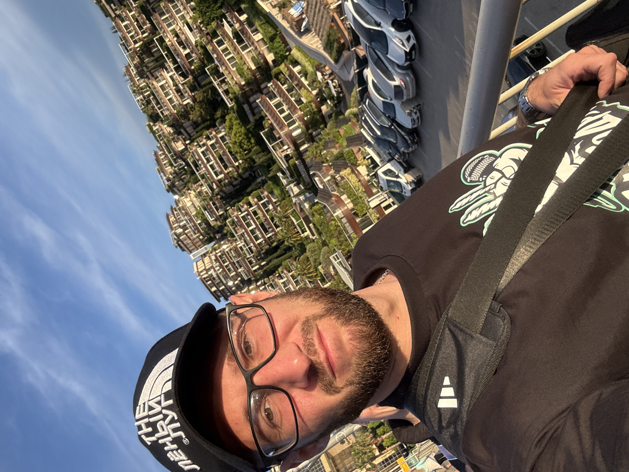 Man in North Face cap takes selfie