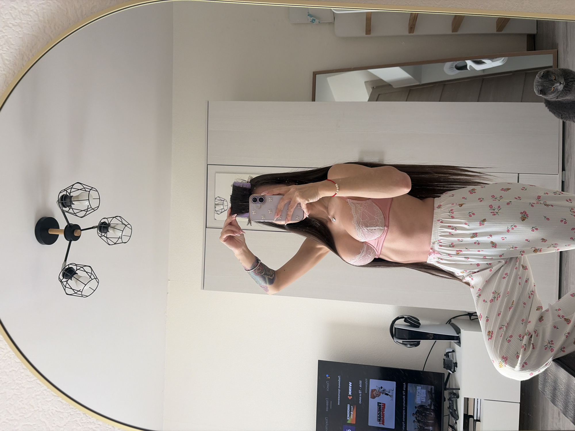 Woman takes morning mirror selfie at home in Saint Petersburg