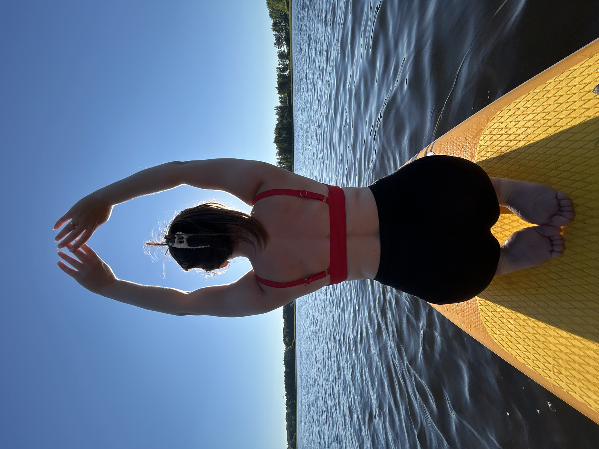 Sunny afternoon paddleboarding on a lake near Chaykovsky