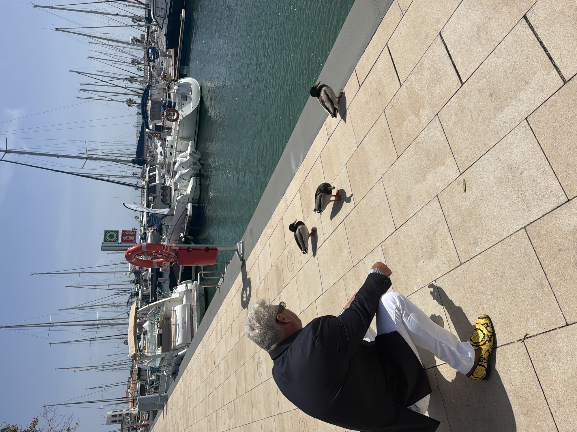 Casual morning scenes documented around Sitges marina and streets