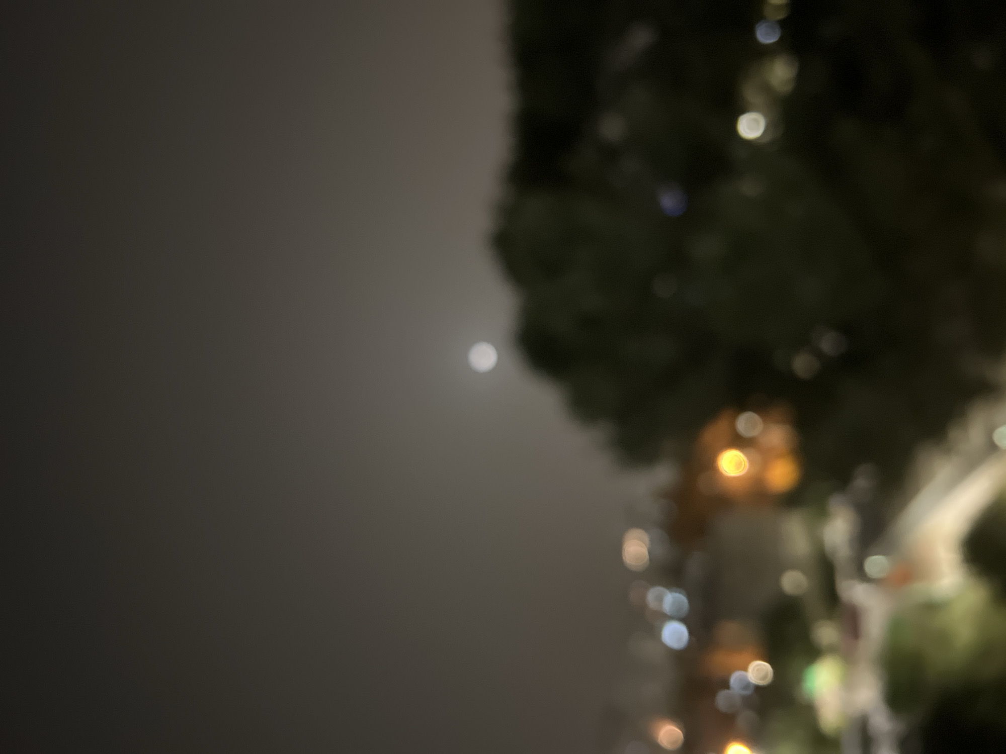 Nearly full moon observed over Kiryat Bialik nightscape