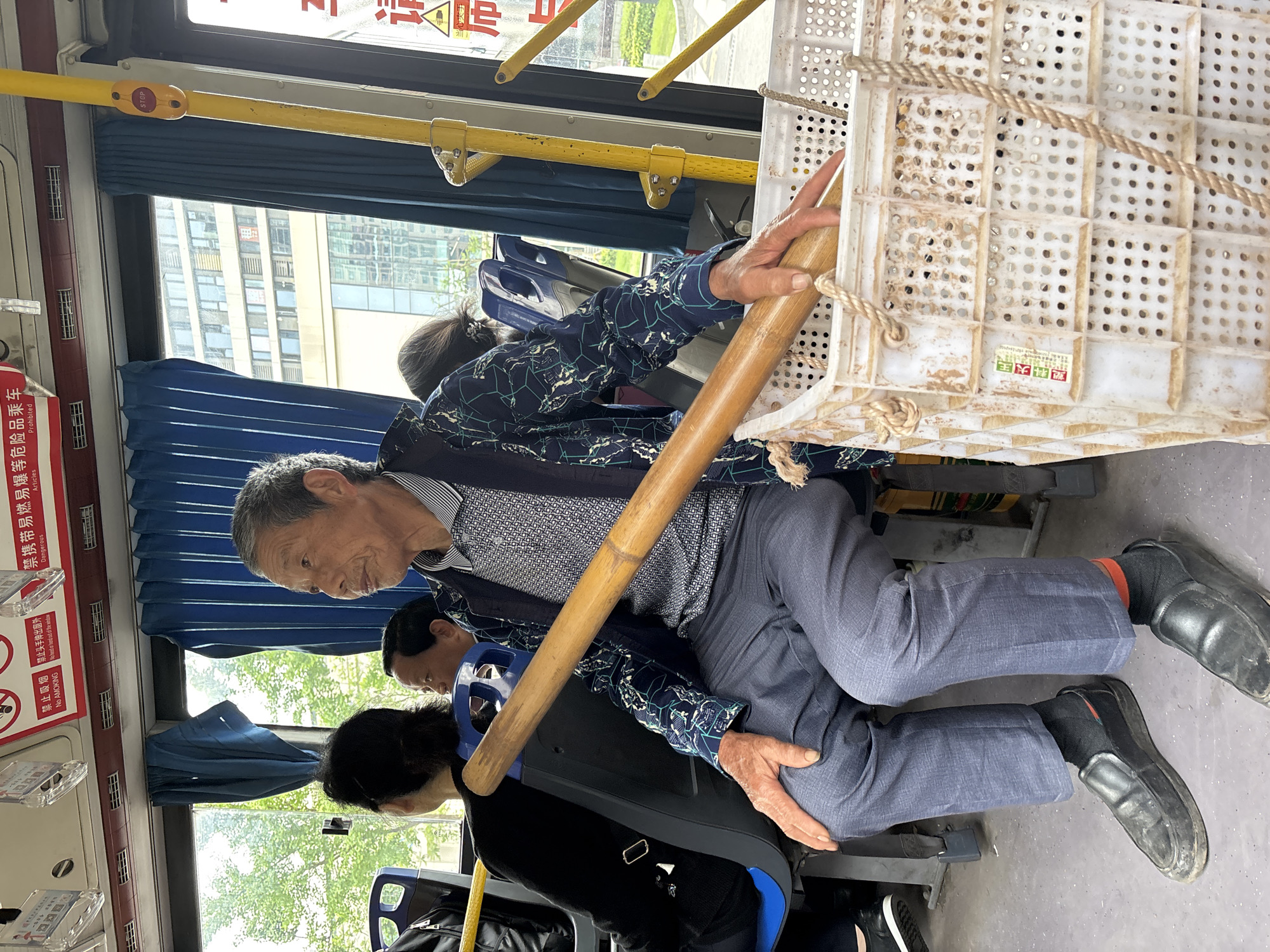 Elderly passenger rides public bus in Jiangjin, China