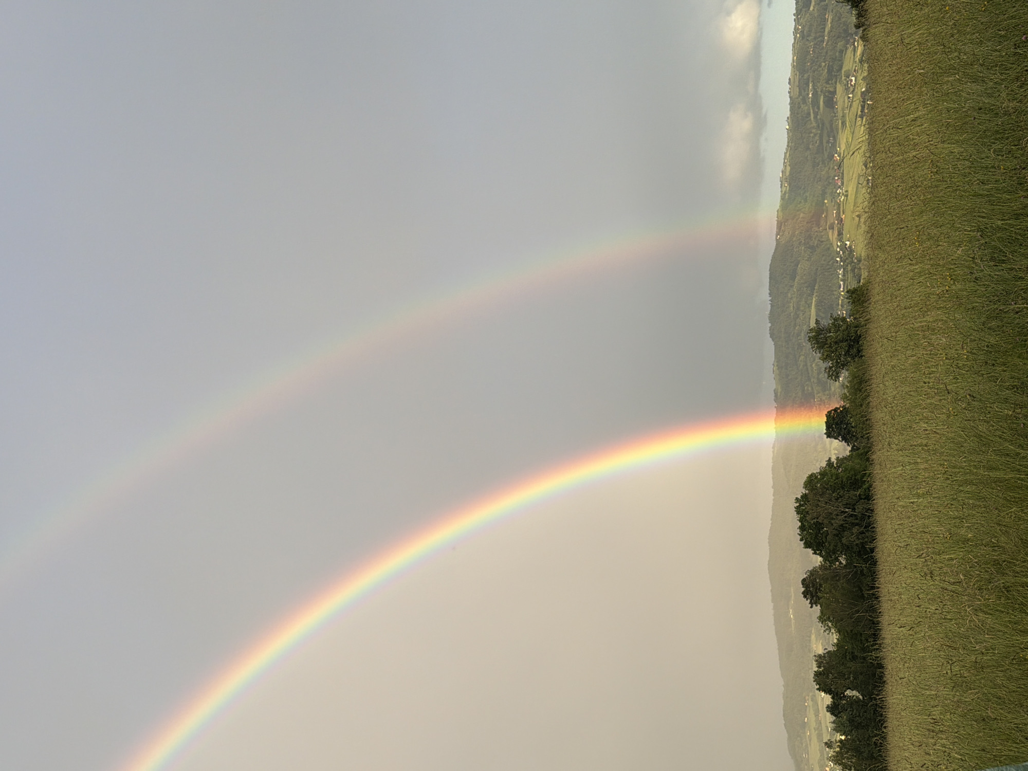 Double rainbow appears over Męcina village, Poland