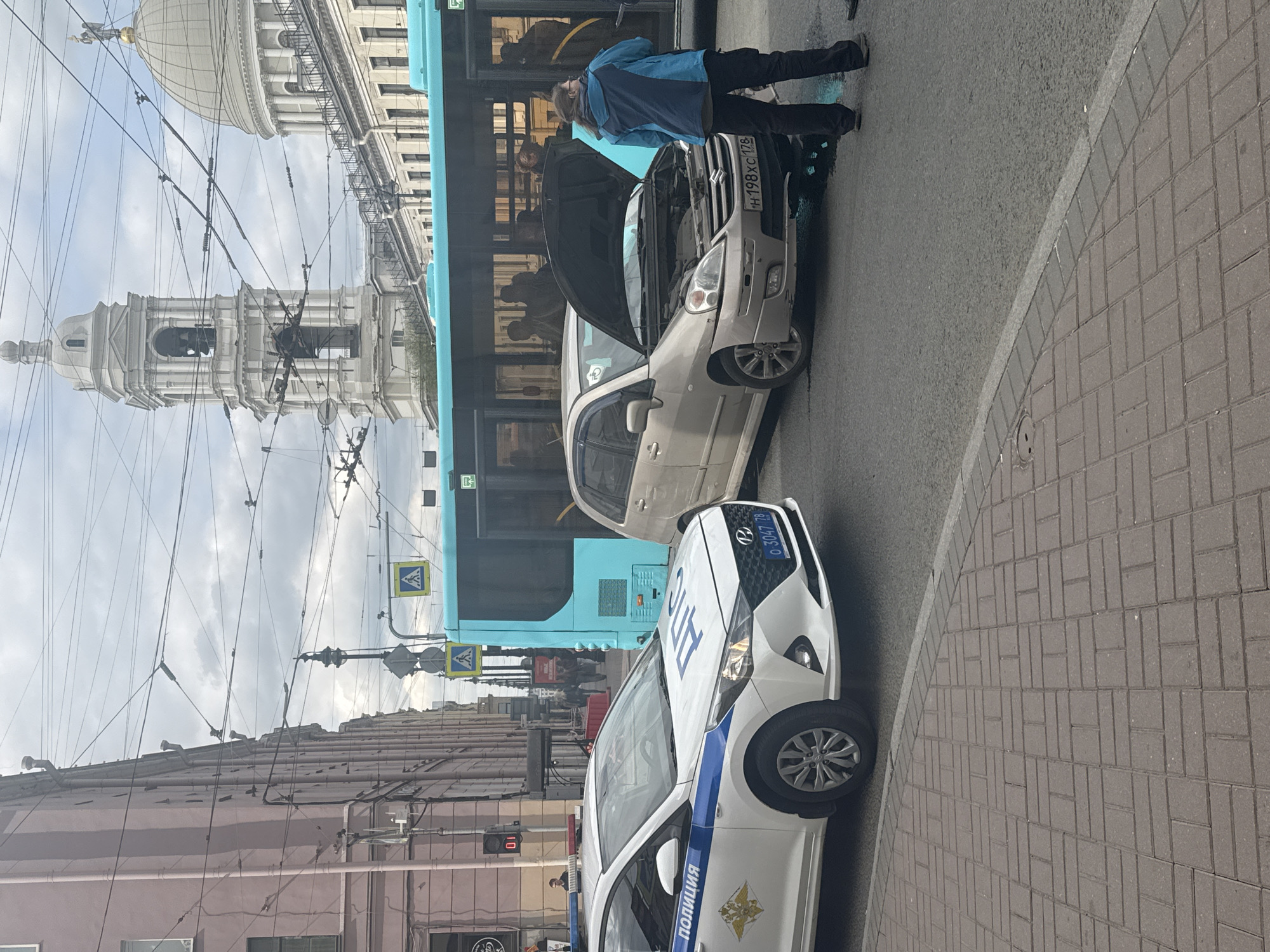 Ordinary Tuesday morning unfolds across Saint Petersburg streets and waterways