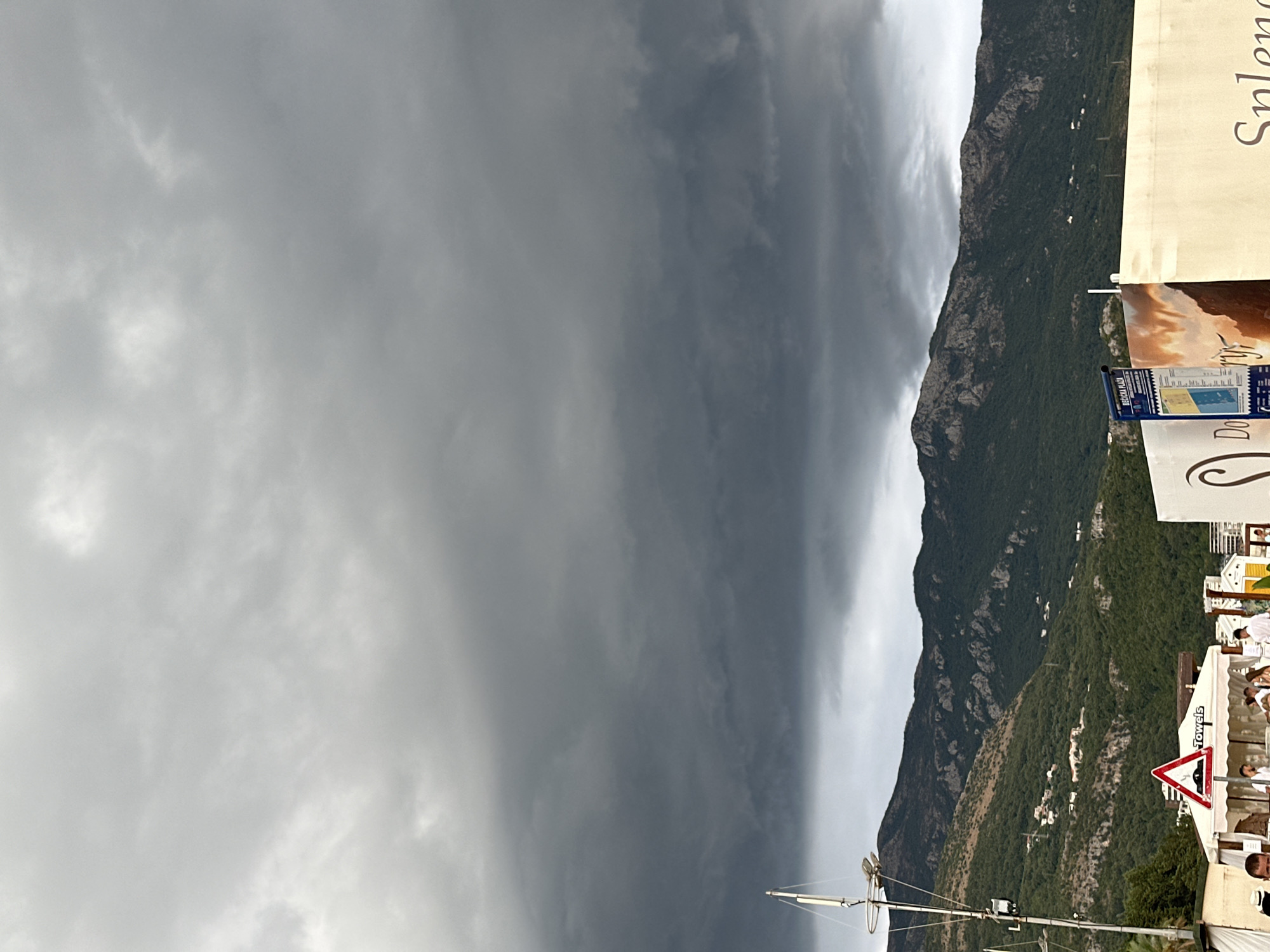 Summer rainstorm rolls through Boreti's coast and streets