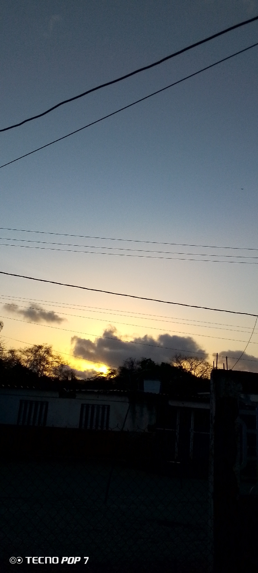 Sunset documented in 30-frame sequence over Altagracia, Venezuela neighborhood