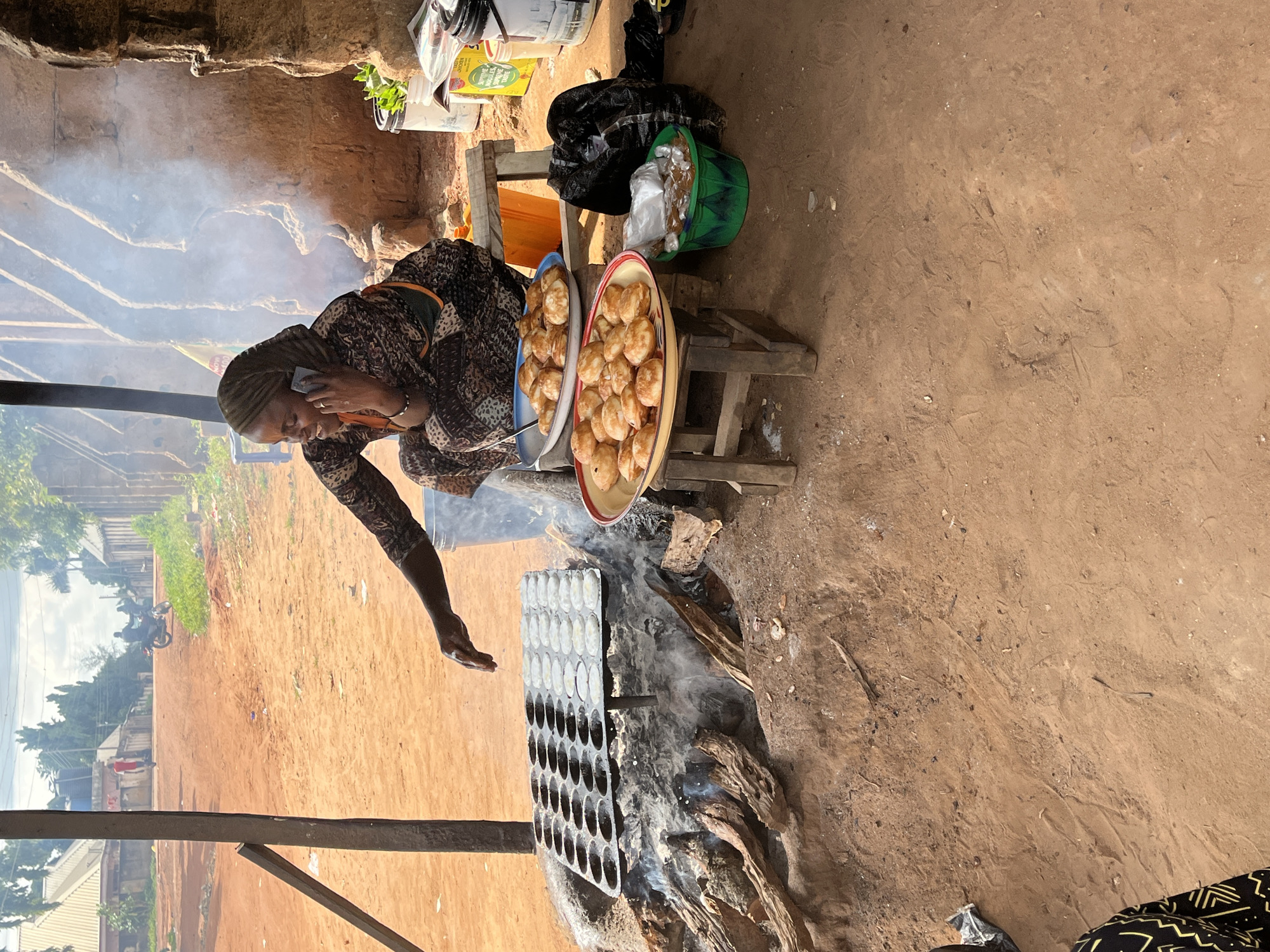 A moment at a Lafia market stall, phone in hand