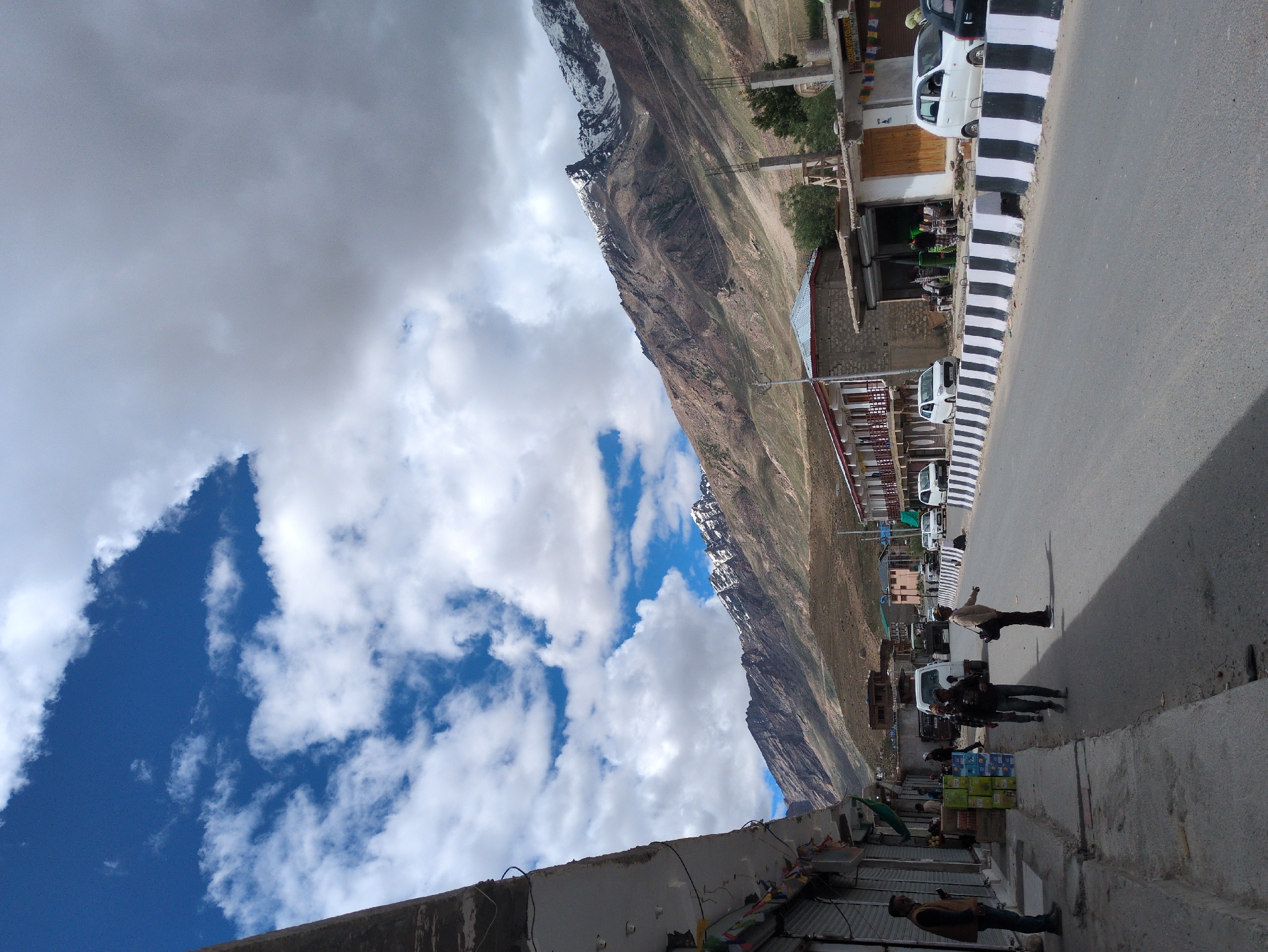 Padum street scene with dramatic Himalayan peaks behind