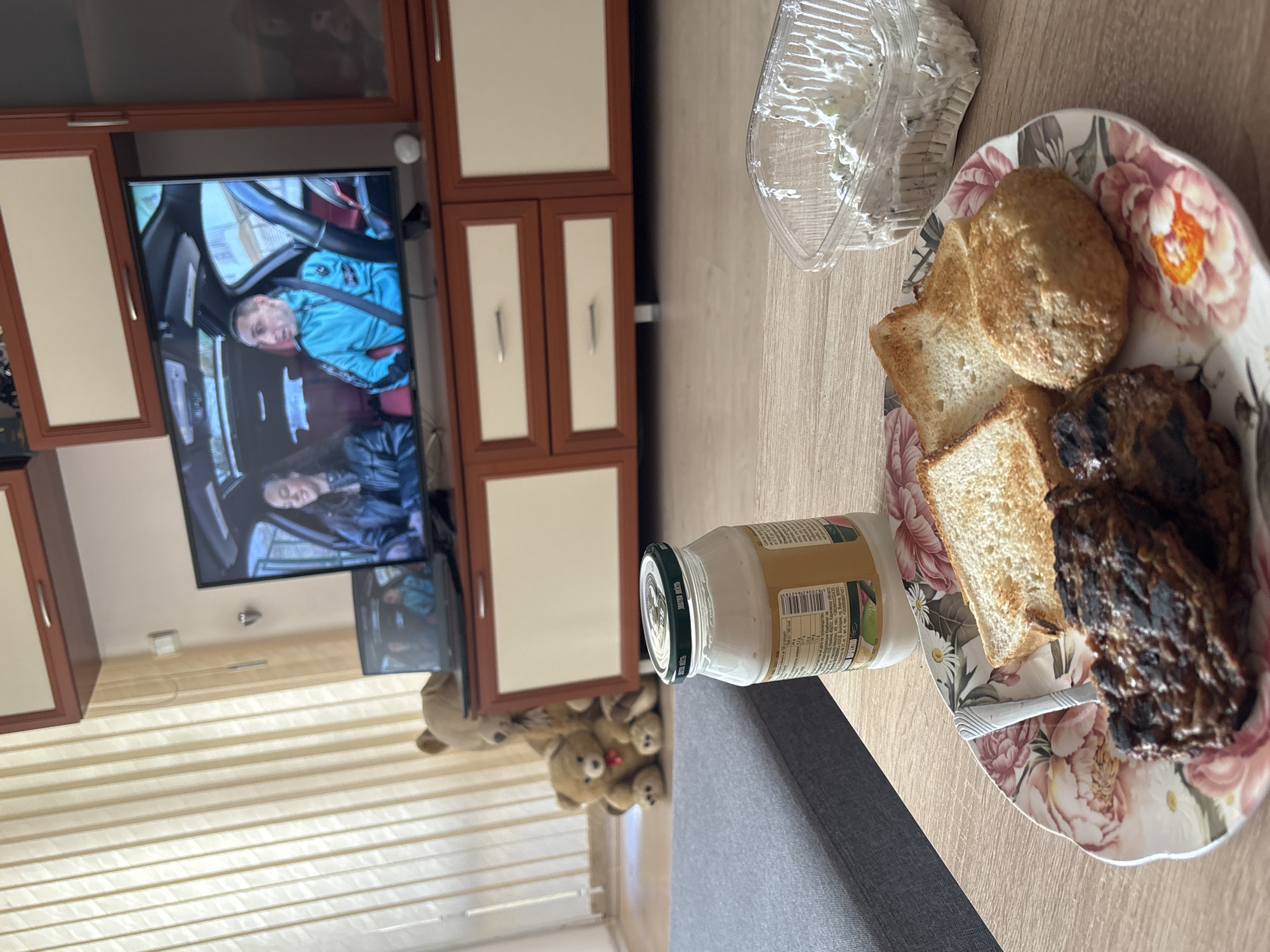 Morning domestic scene captured in Varna showing TV programming