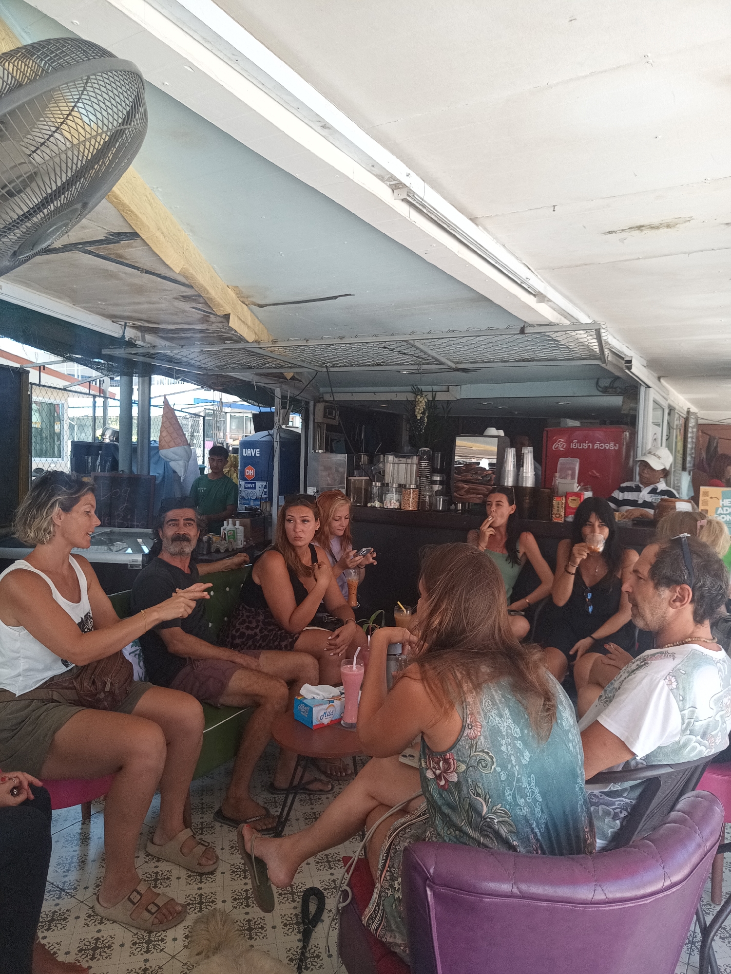 Late-night cafe gathering captured in Koh Phangan, Thailand