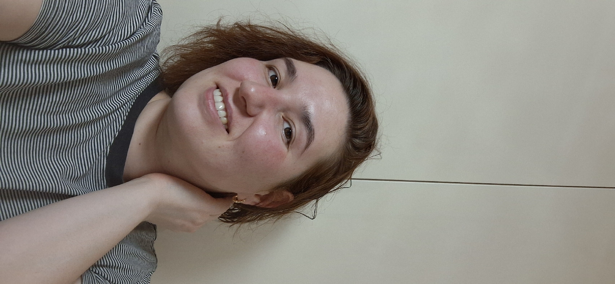 Woman takes selfies with decorative items at Chaikovsky home