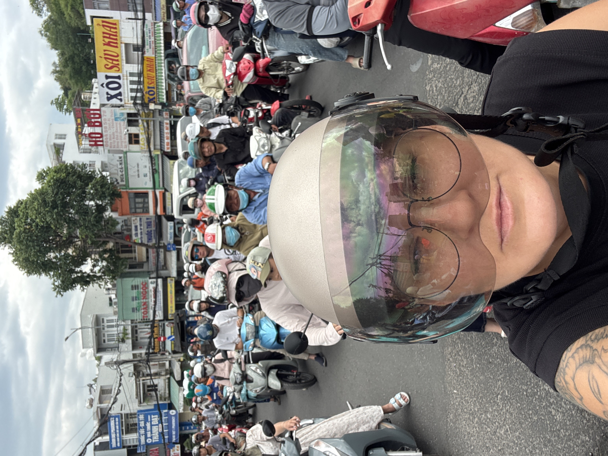 Scooter ride pauses at Nha Trang railroad crossing