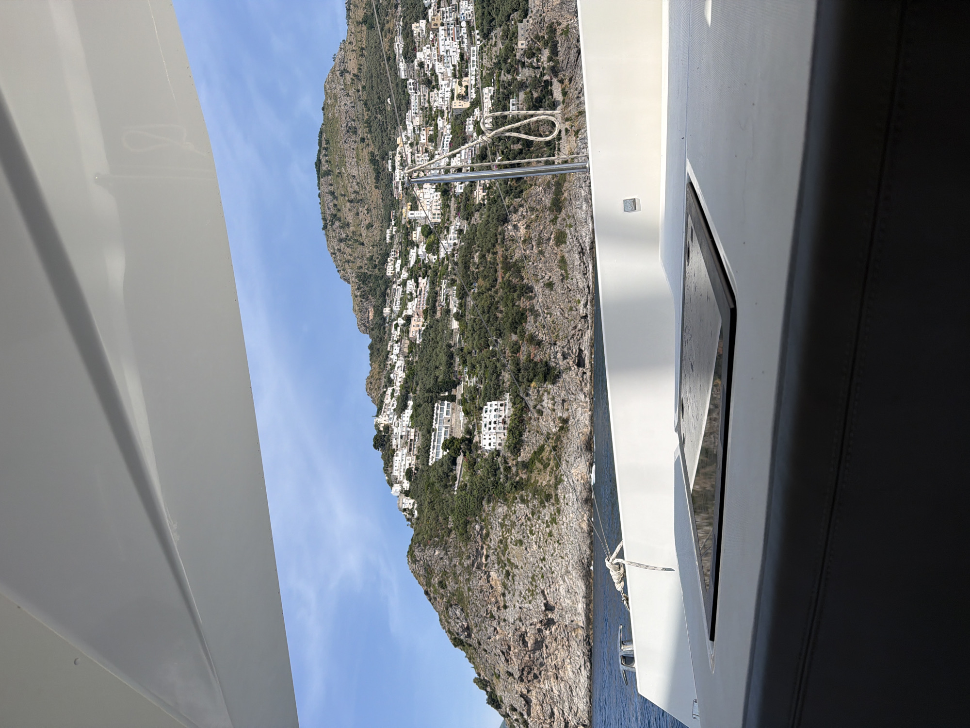 Boat passenger documents scenic views of Praiano coastline