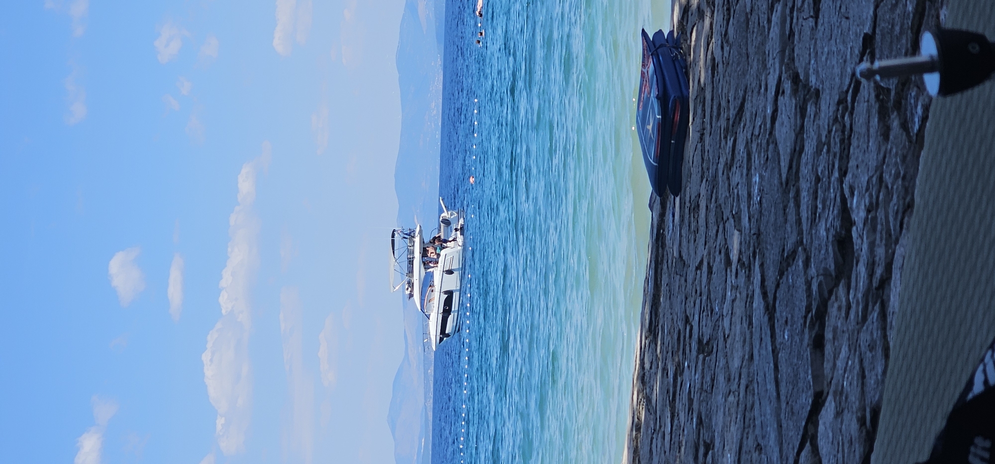 Busy summer morning on the water and beaches of Supetar