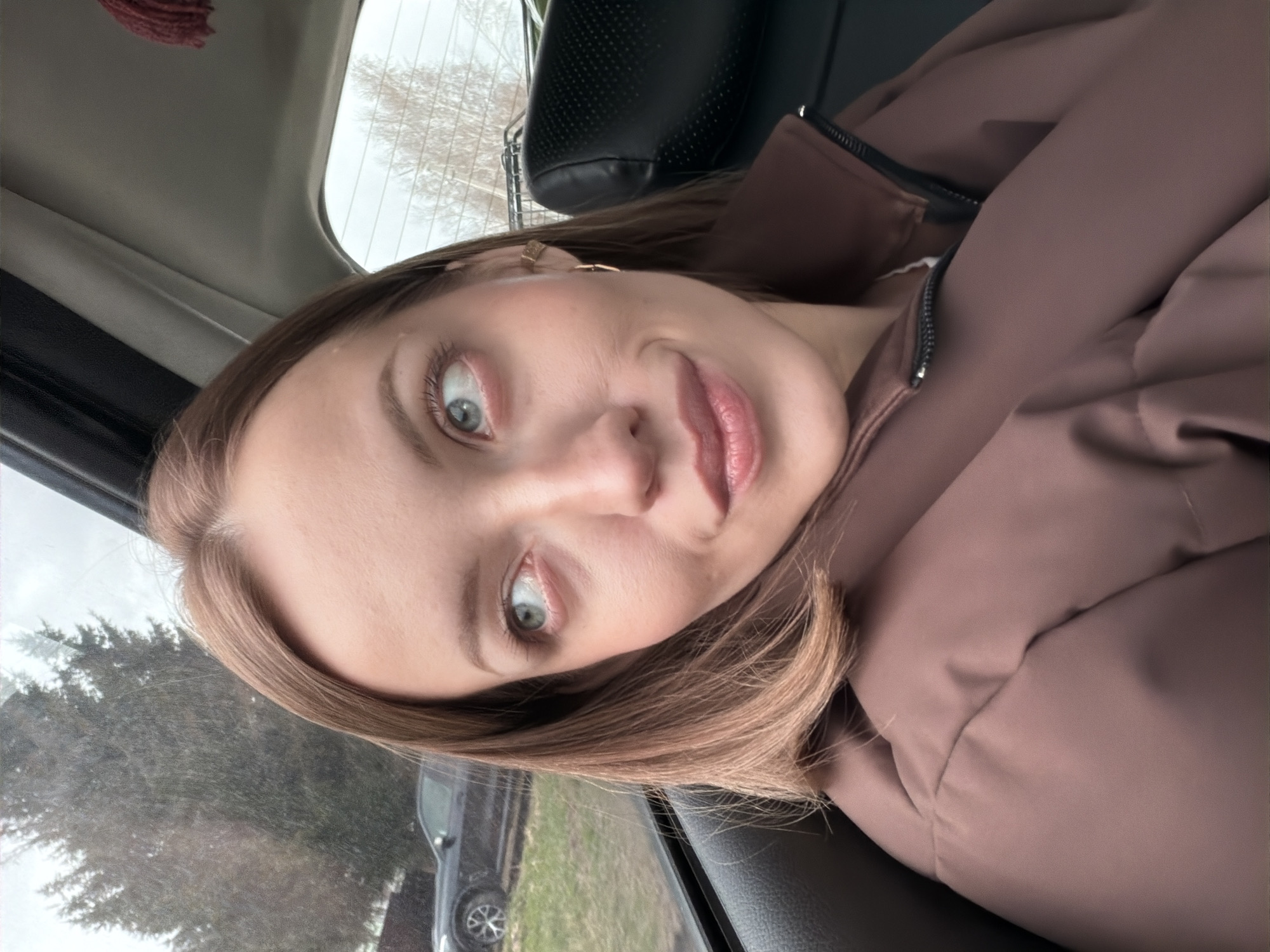 Woman Takes Selfie in Car in Раздолье, Russia
