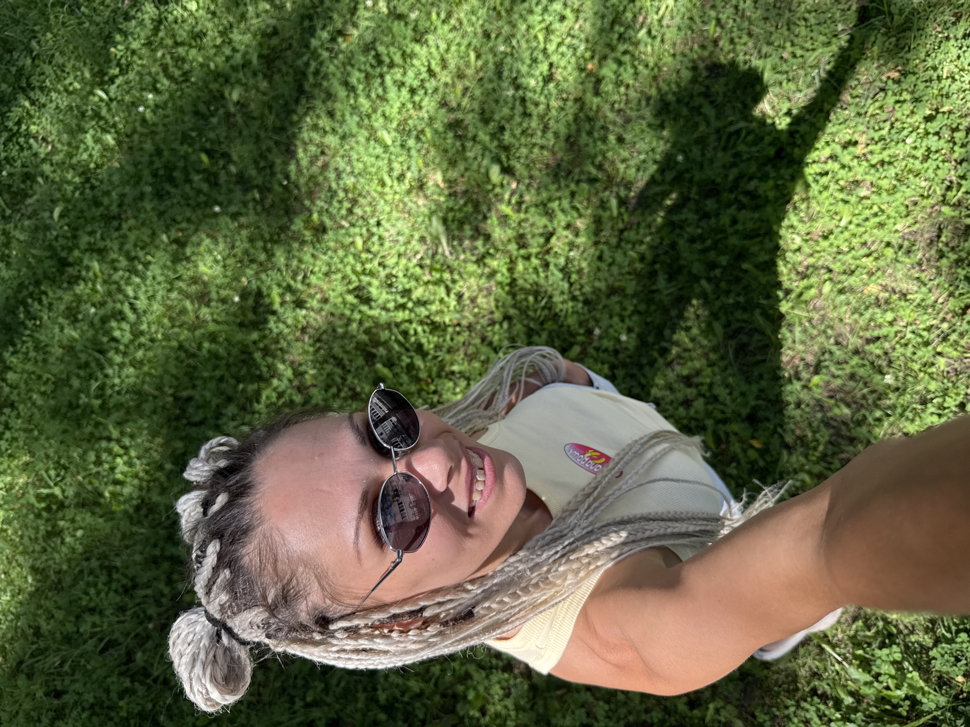 Afternoon in the park: grass, blue sky, braids, and selfies