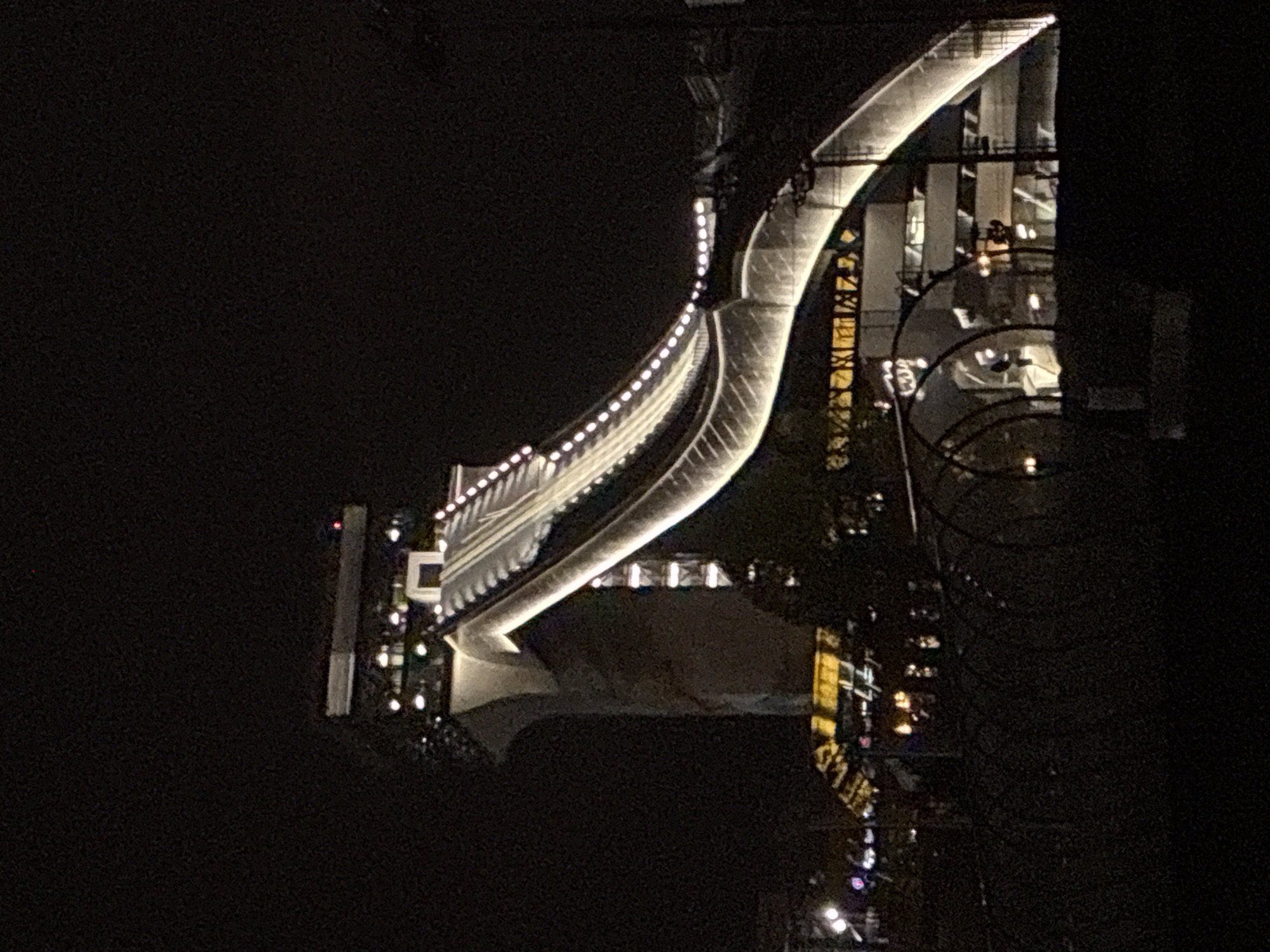 Illuminated modern bridge captured at night in Moscow