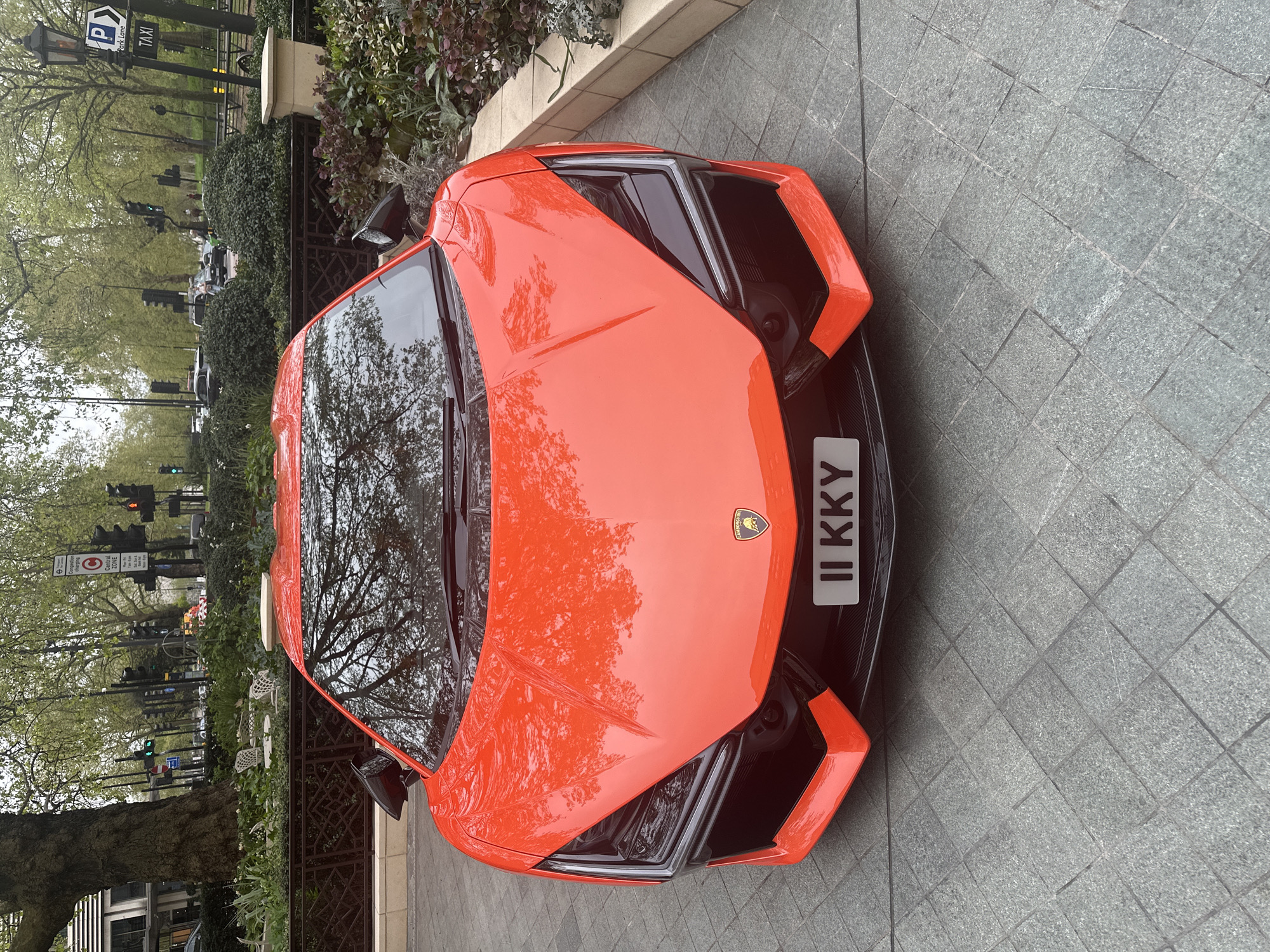 Orange Lamborghini spotted parked on London sidewalk