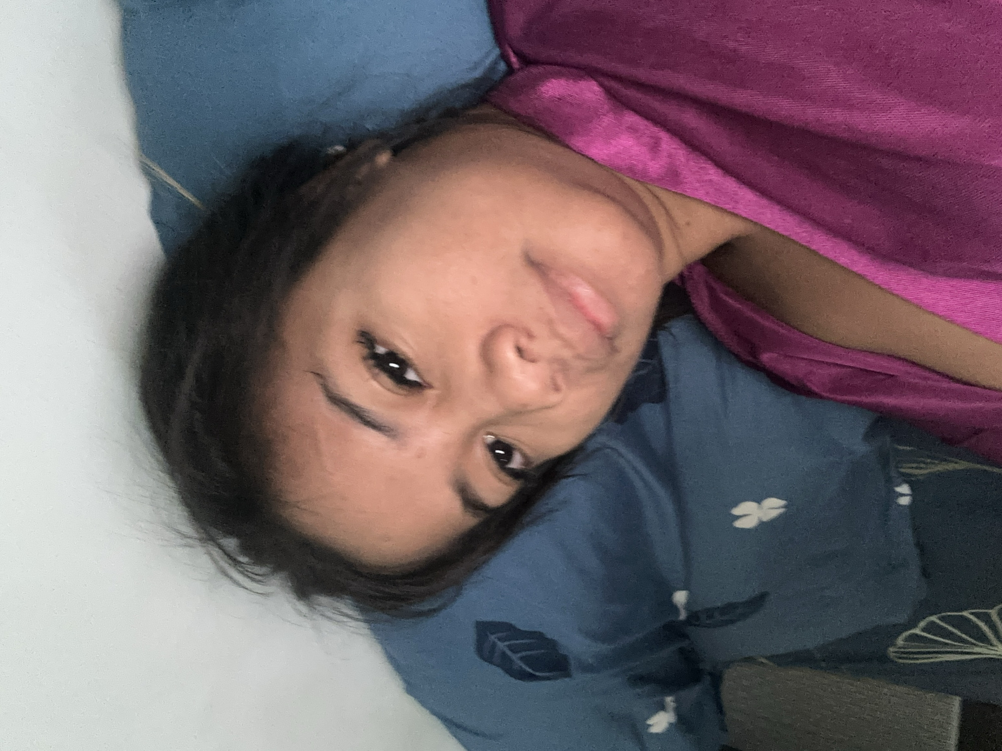 Woman enjoys lazy morning with desserts and cat in Sukawati bedroom