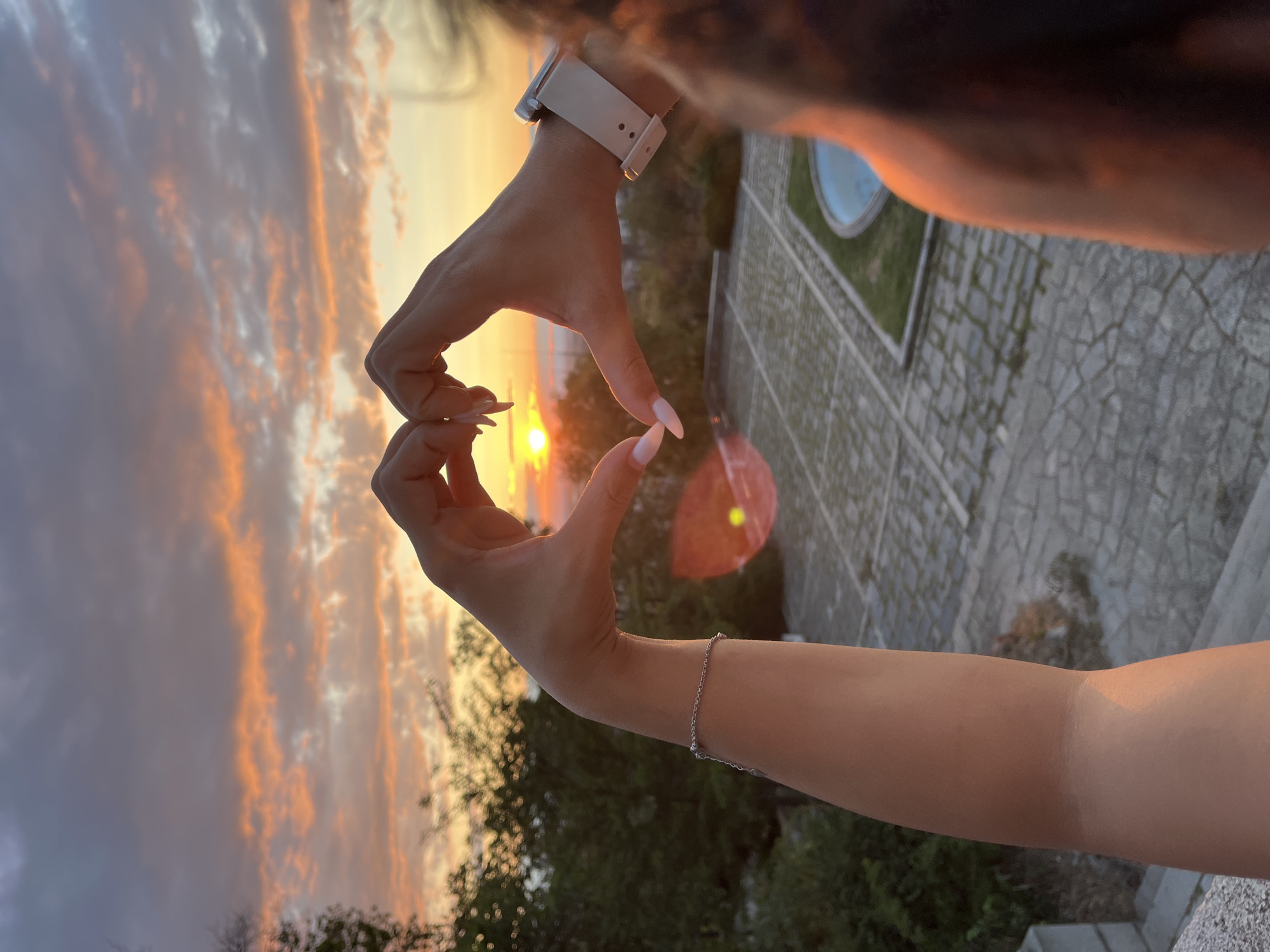 Heart hands at golden hour on Plovdiv's Nebet Tepe hill