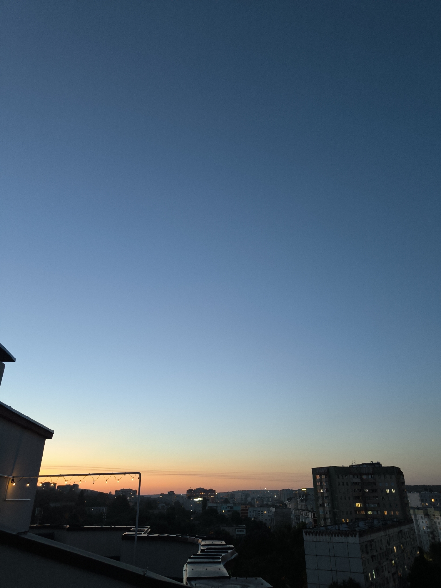 Chișinău rooftop at dusk, Soviet skyline and an indoor wind-down