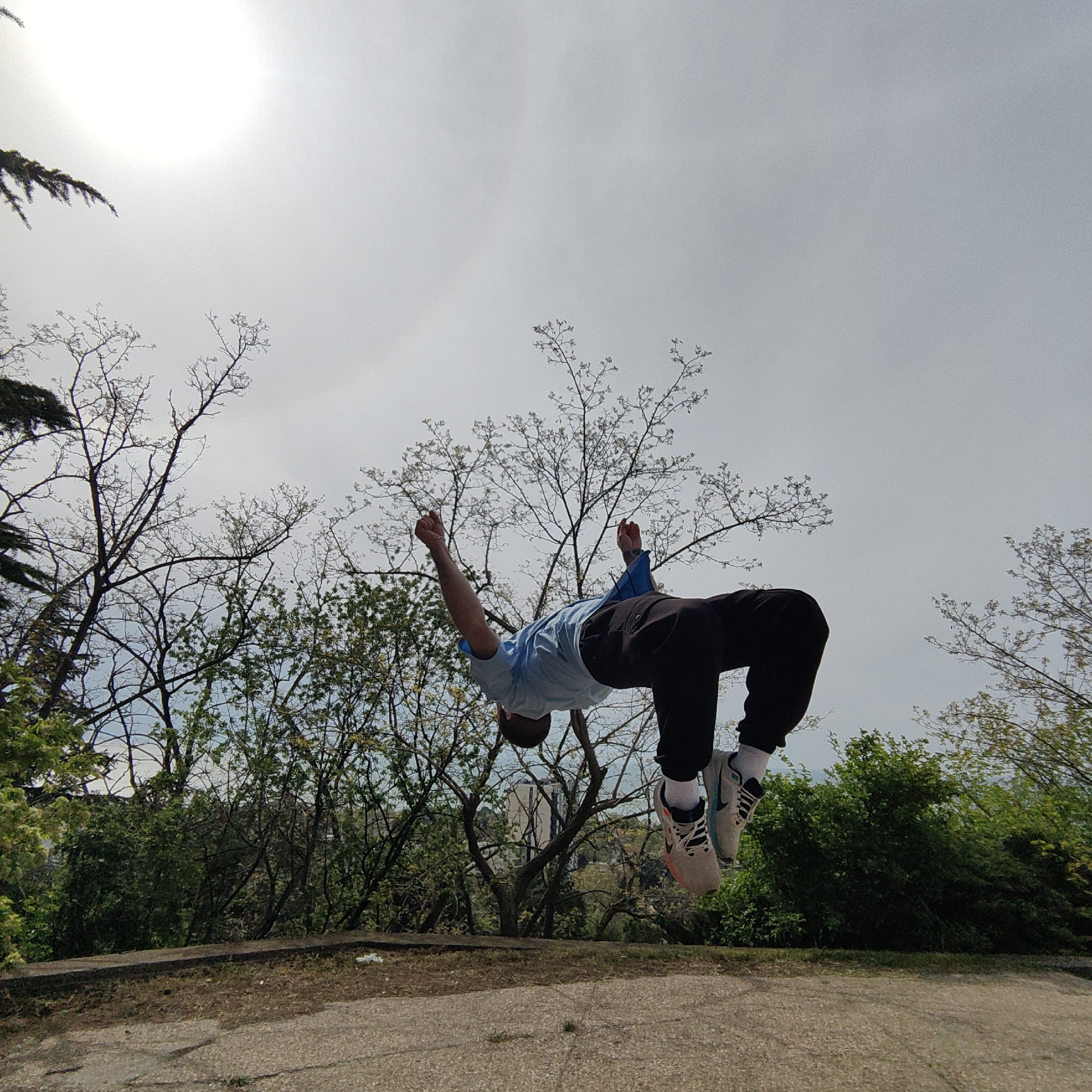 Man performs backflips in outdoor park setting in Varna