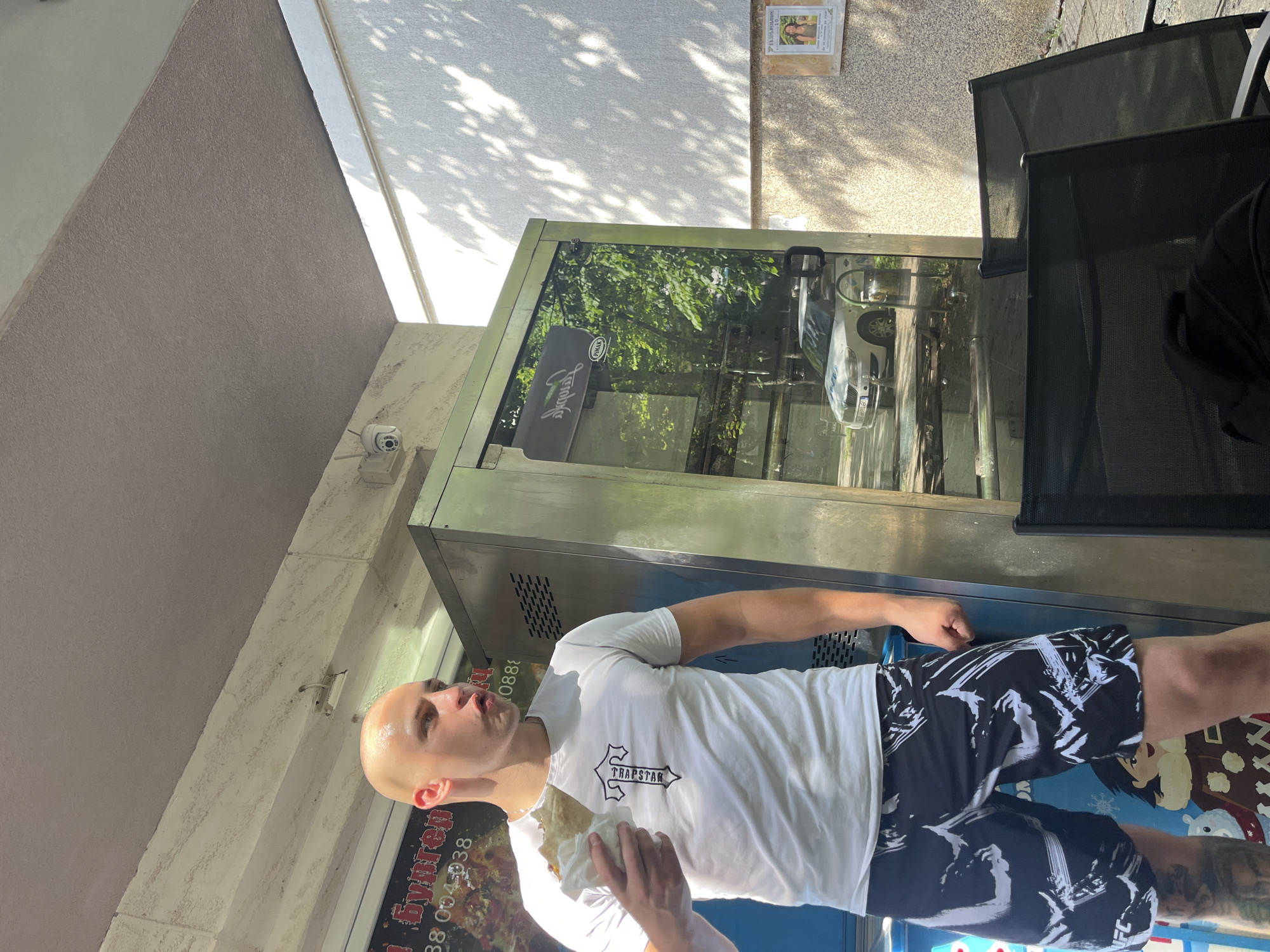 Afternoon break at a Vratsa patio, tattoos and snacks in frame