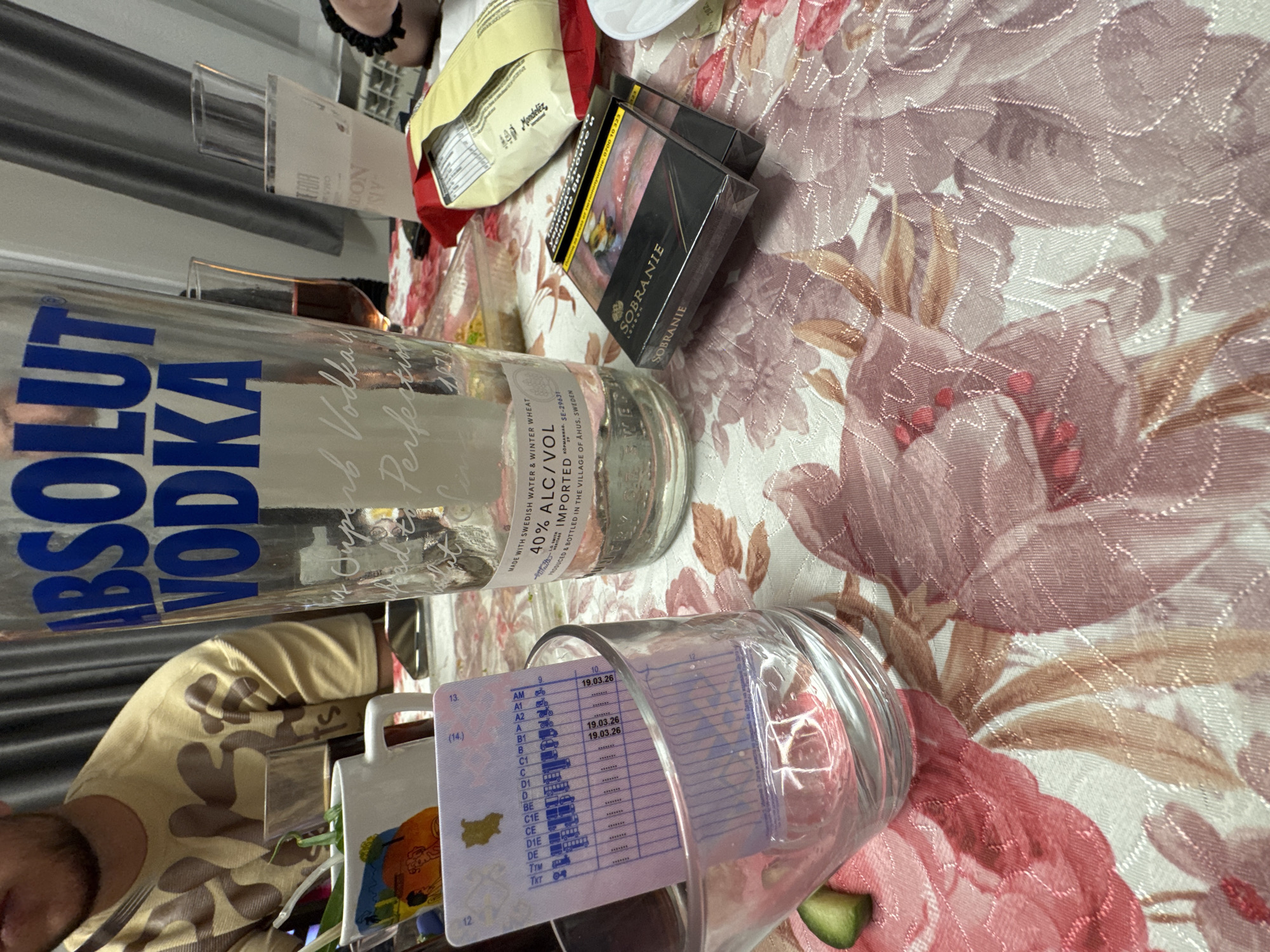 Informal gathering documented with vodka, glassware in Topoli, Bulgaria