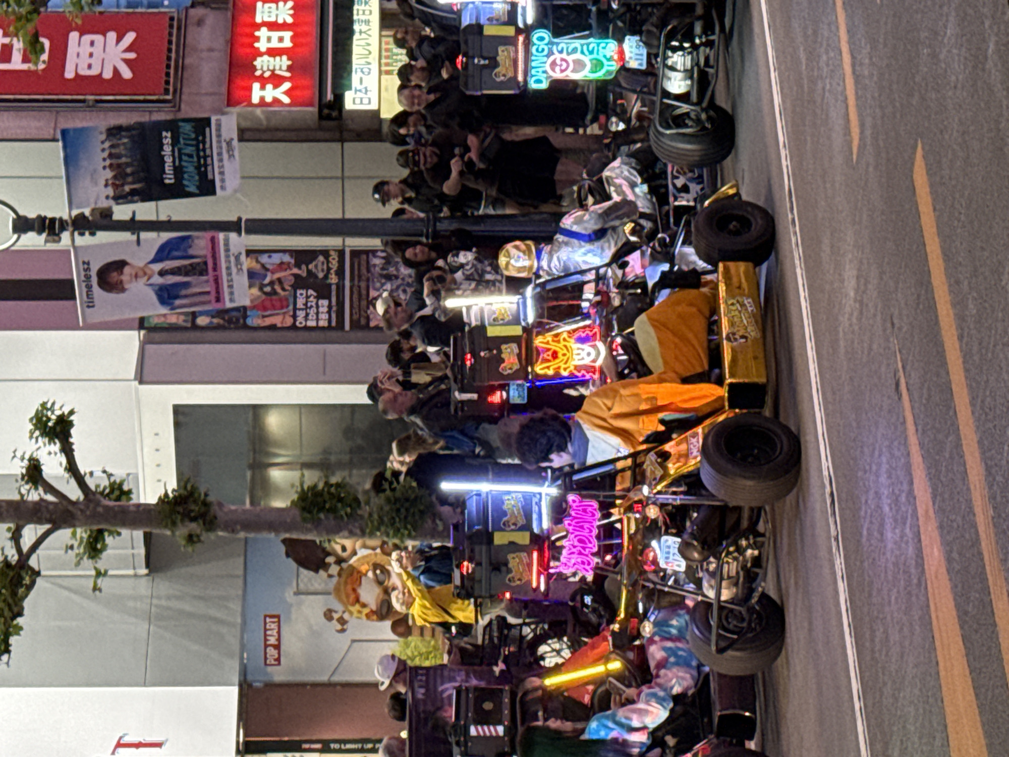 Custom vehicle parade draws crowds in nighttime Shibuya streets