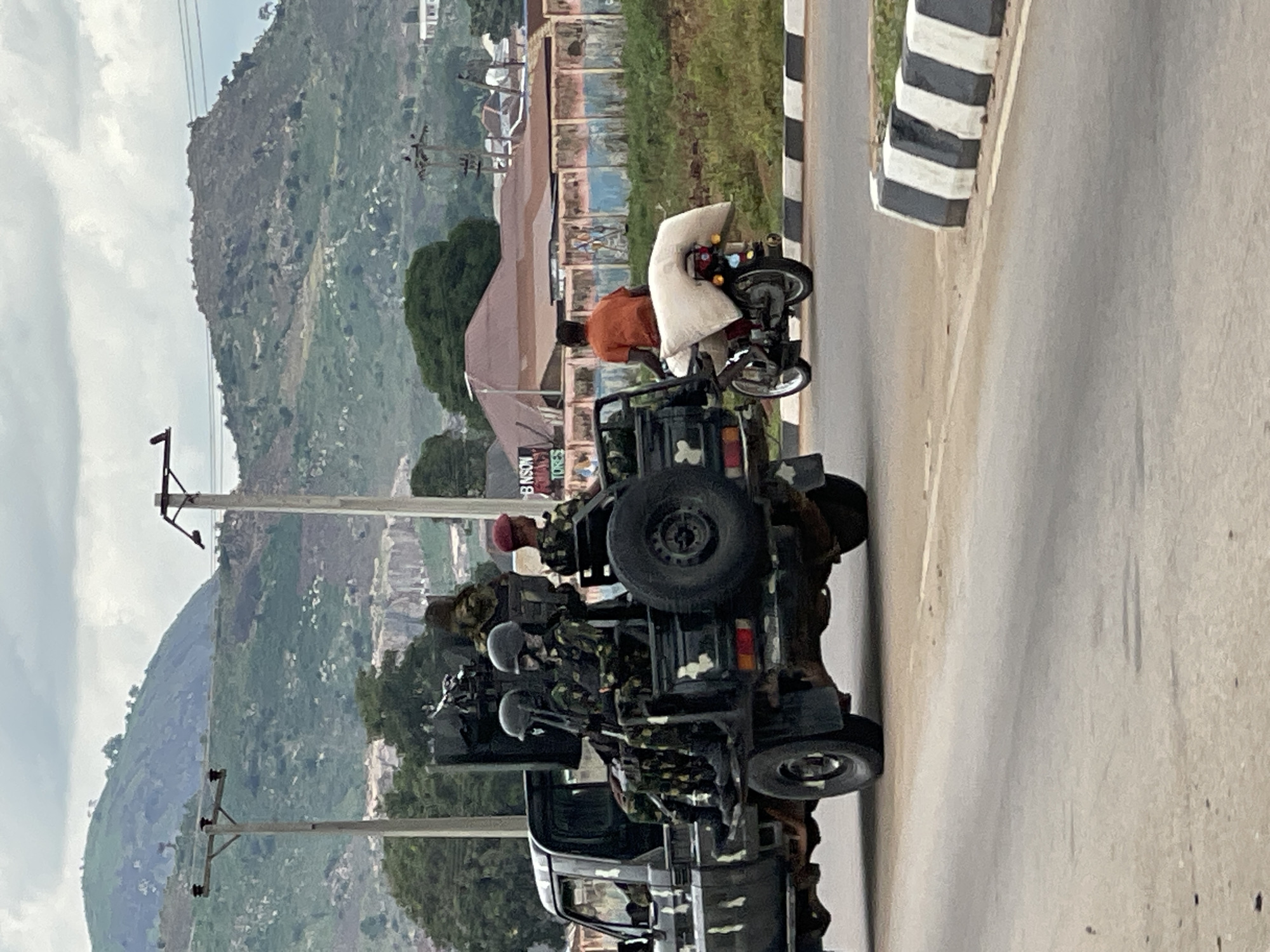 Roads, mountains, and cell towers near Abuja's Immigration Quarters