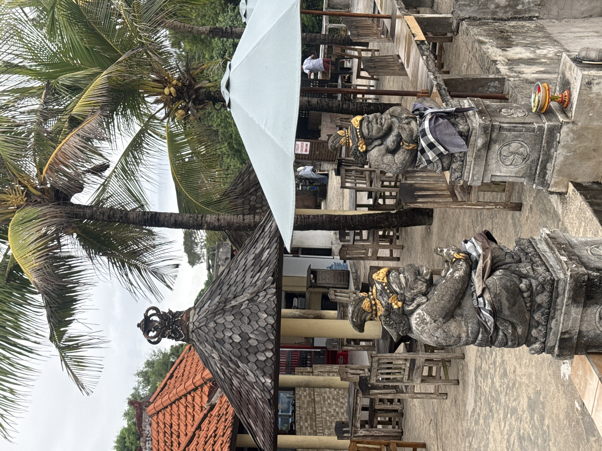 Stone statues with traditional decorations observed in Kuta Selatan
