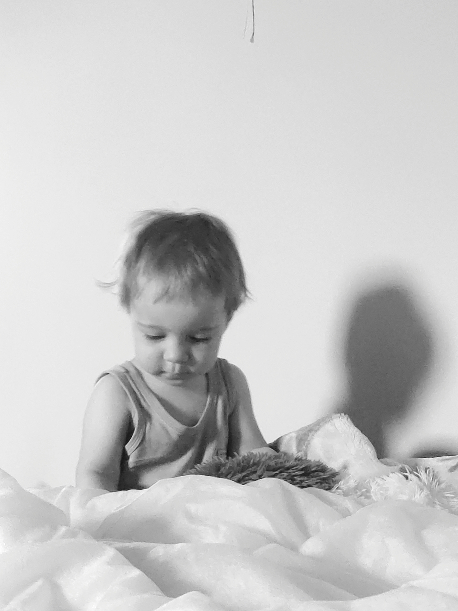 Child photographed in bedroom during early morning hours