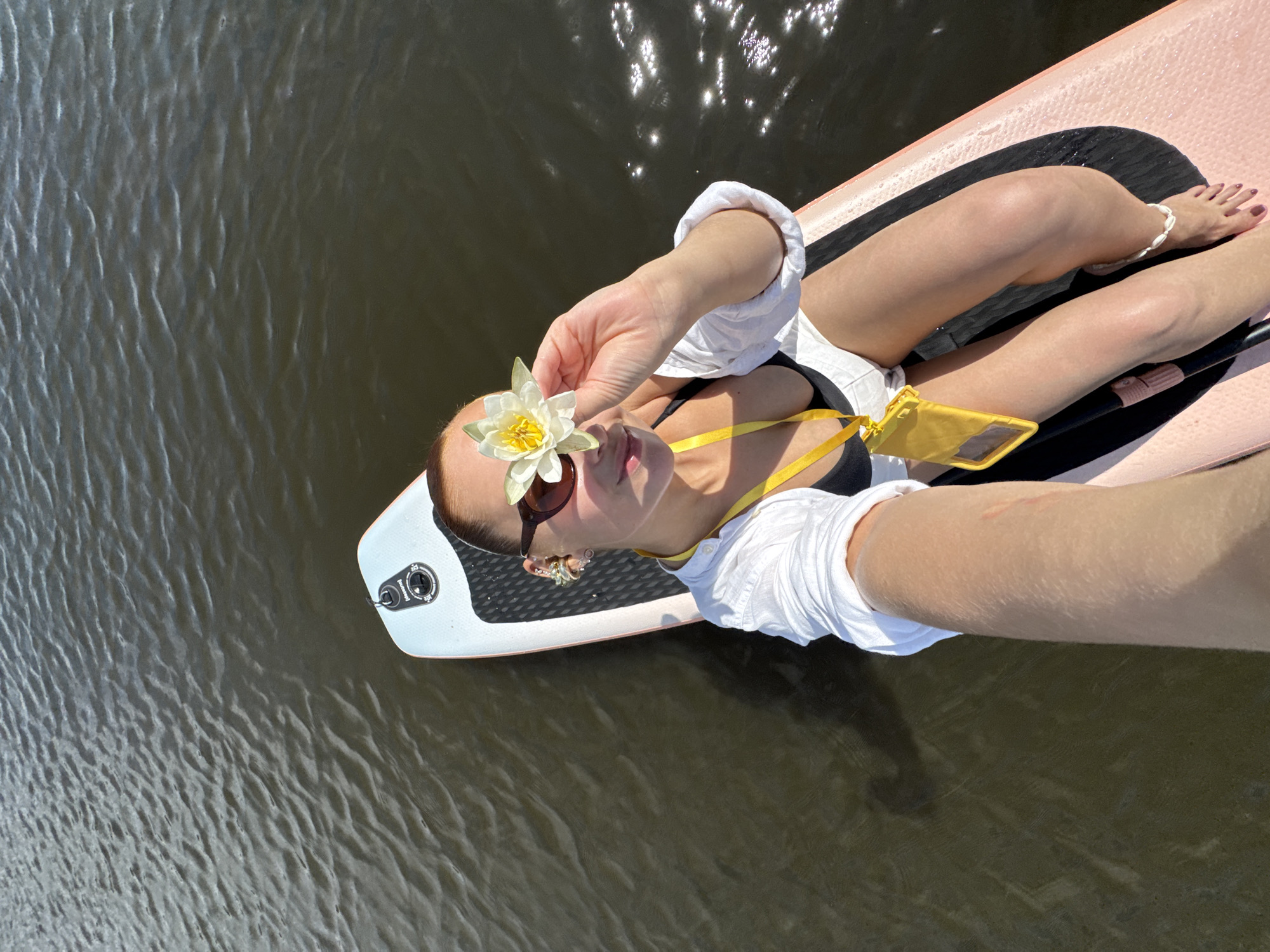 Lazy summer morning on a paddleboard, lake near Chastyye