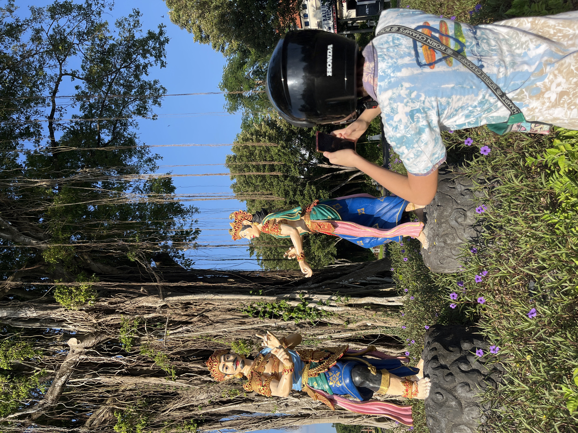 Exploring a Balinese garden full of traditional statues and sculptures