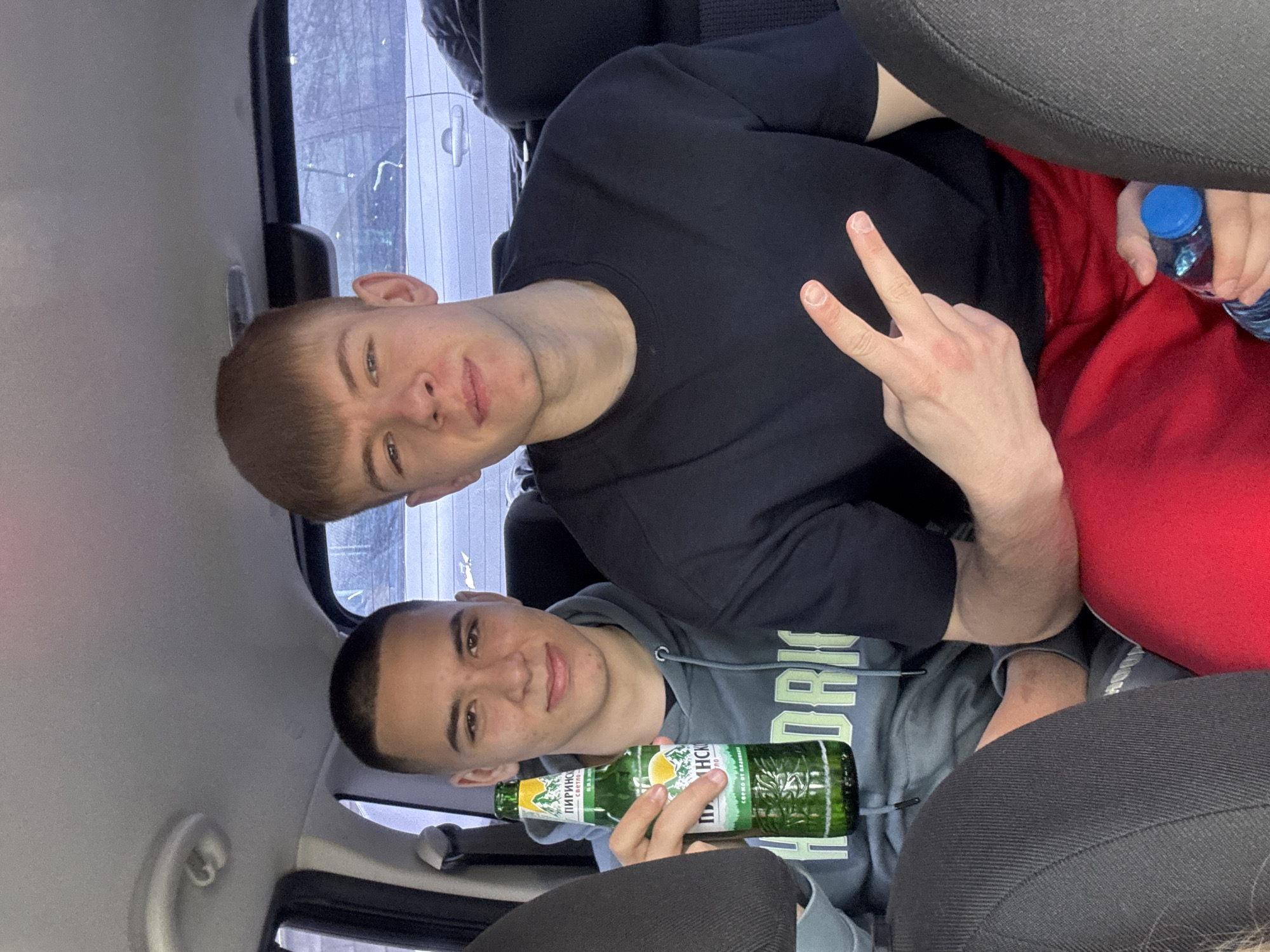Young people pose for photos inside car in Bulgaria