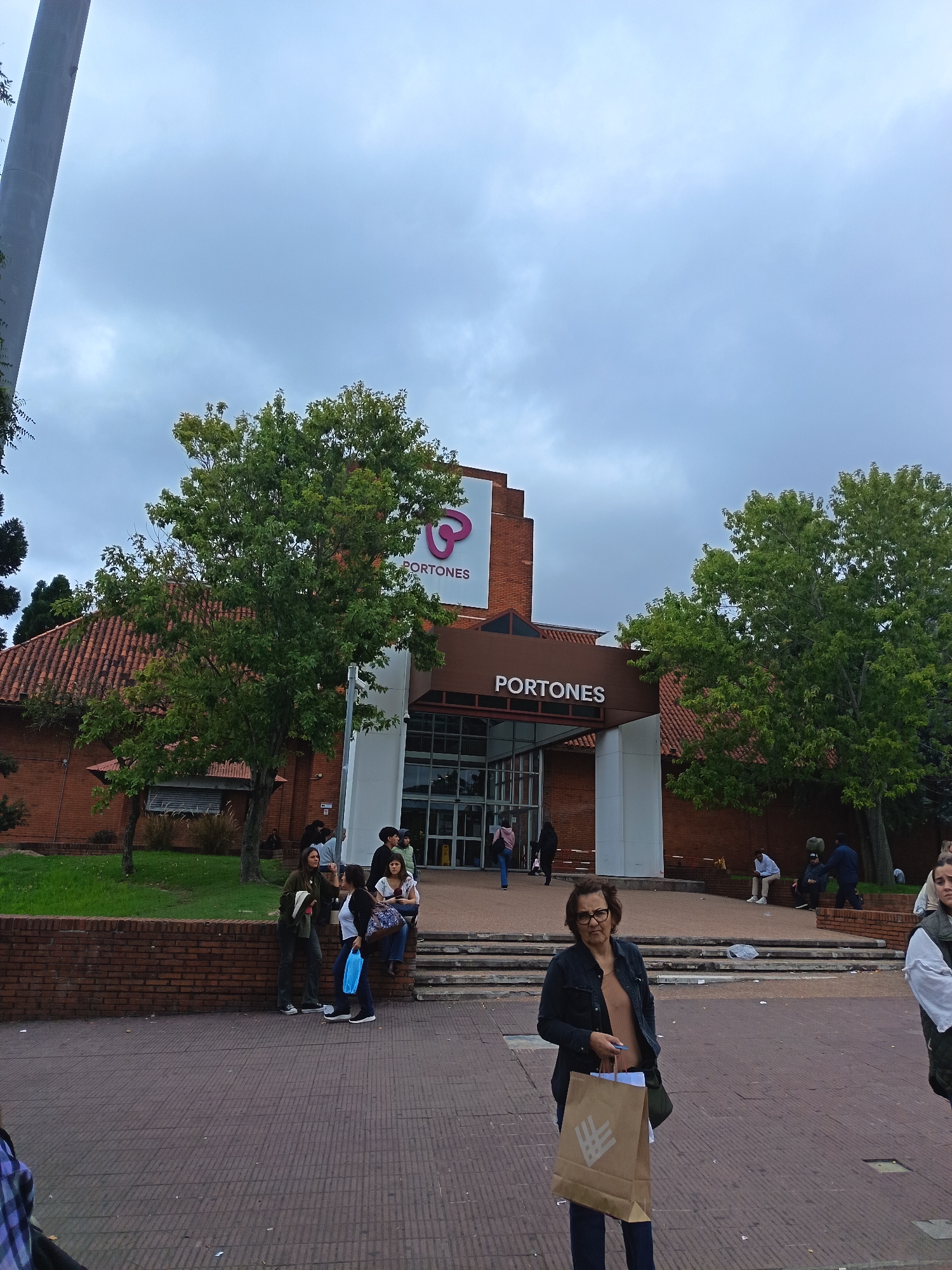 People gather at Portones Shopping Center entrance in Montevideo