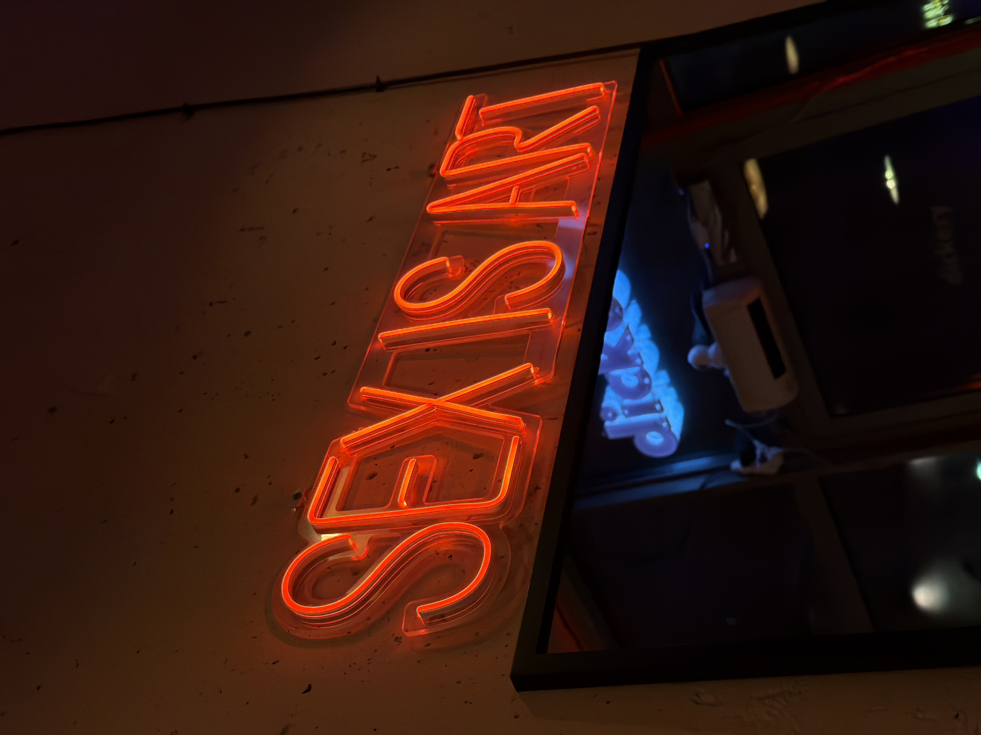 Red neon sex shop sign observed on Gdańsk building