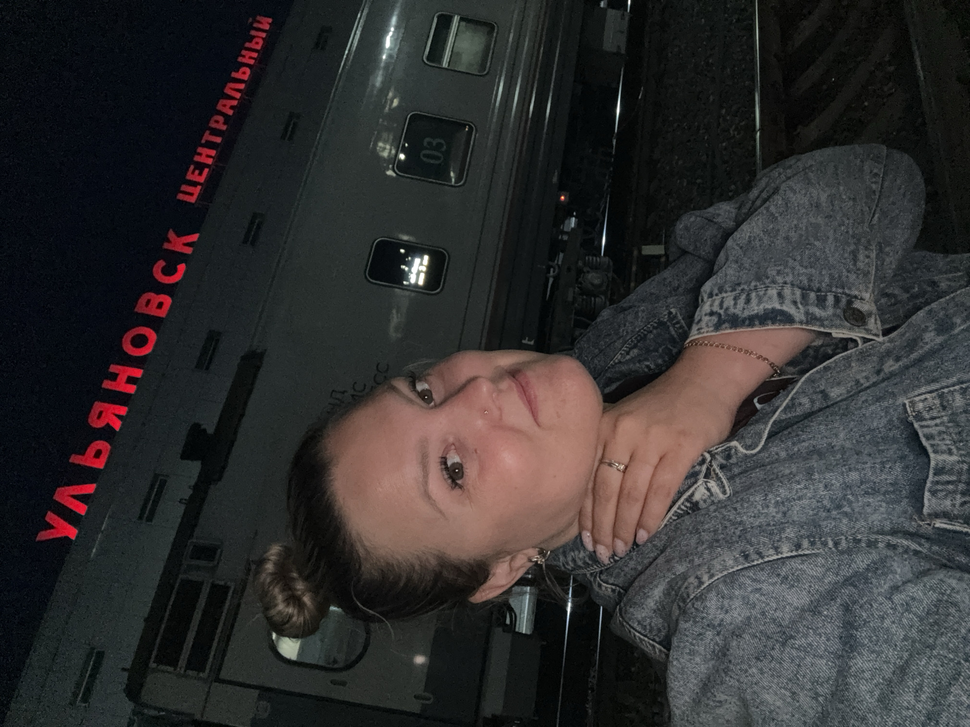 Woman photographs theatrical train exhibition at Ulyanovsk station