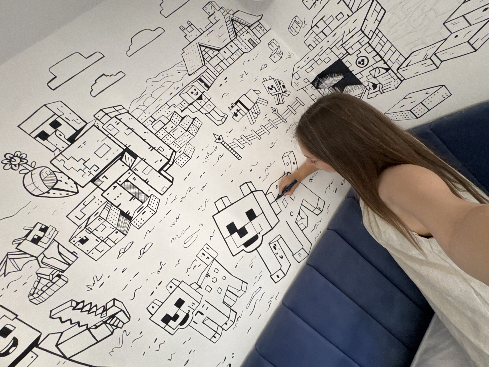 Woman creates Minecraft mural on wall in Budva, Montenegro