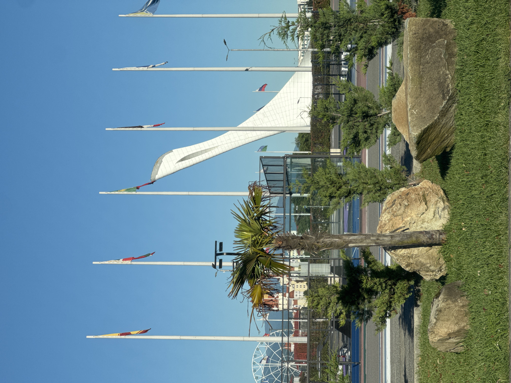 Colorful flags displayed at public space in Sirius, Russia
