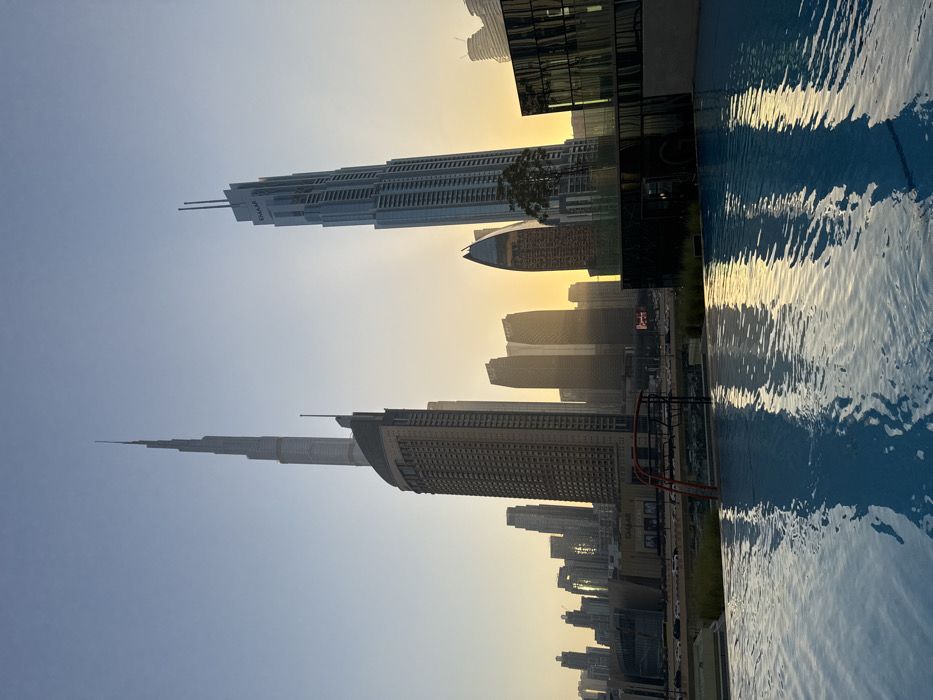 Witness captures golden hour Dubai skyline from rooftop pool