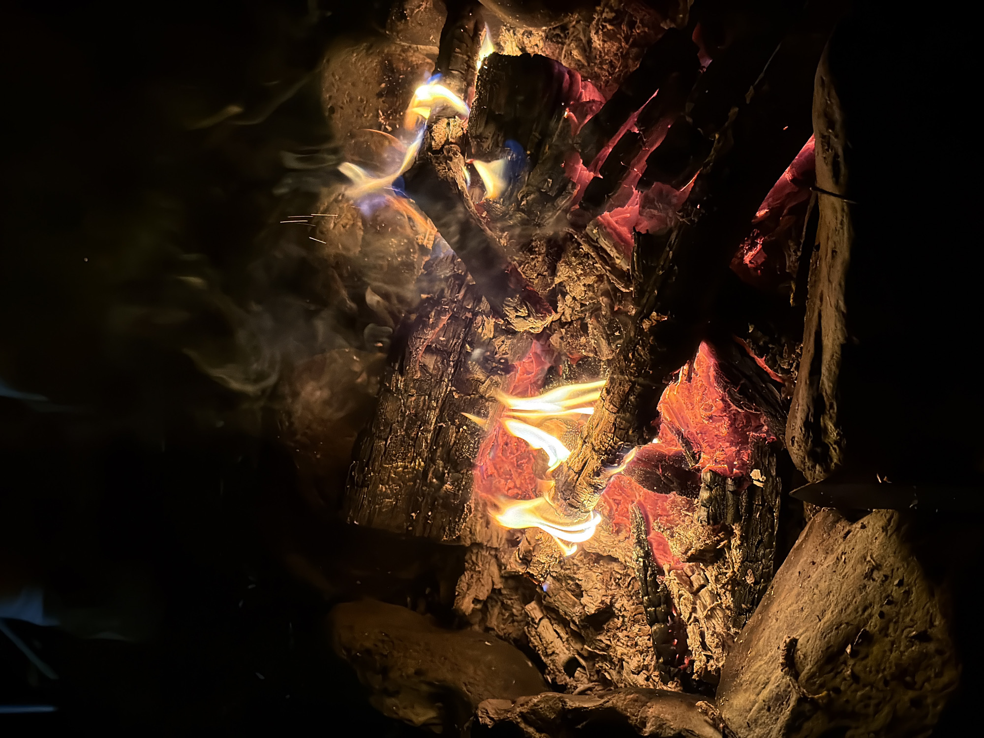 Late-night campfire gathering in the Snoqualmie Pass forest