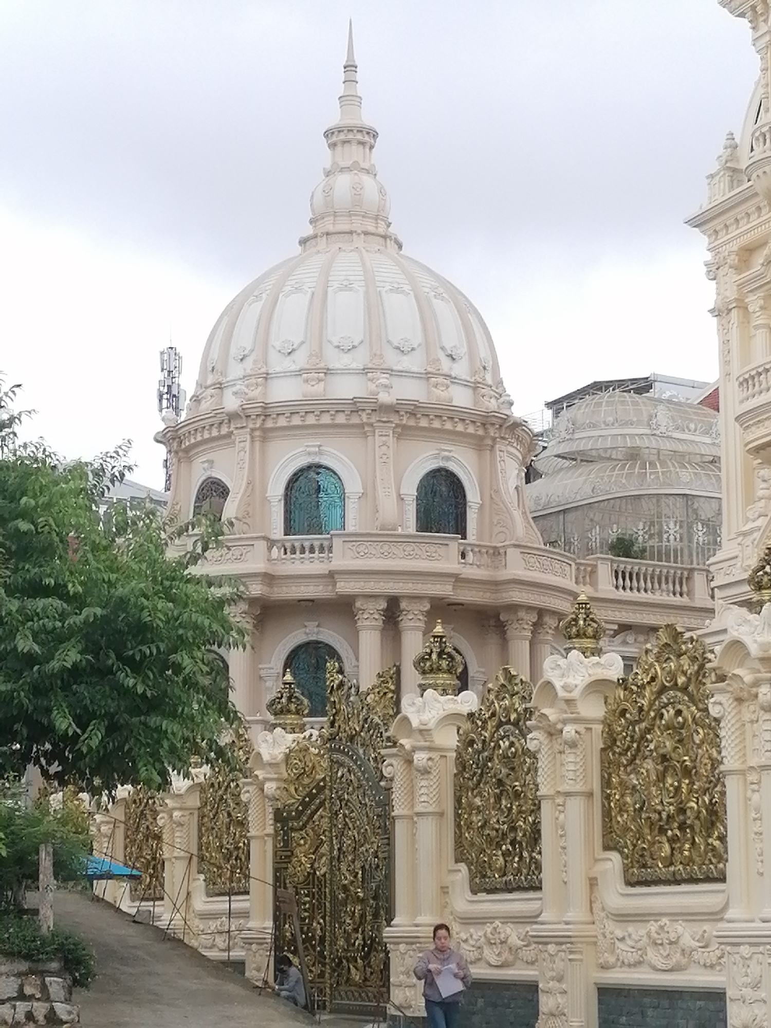 Ornate domed building with golden details documented in Da Lat