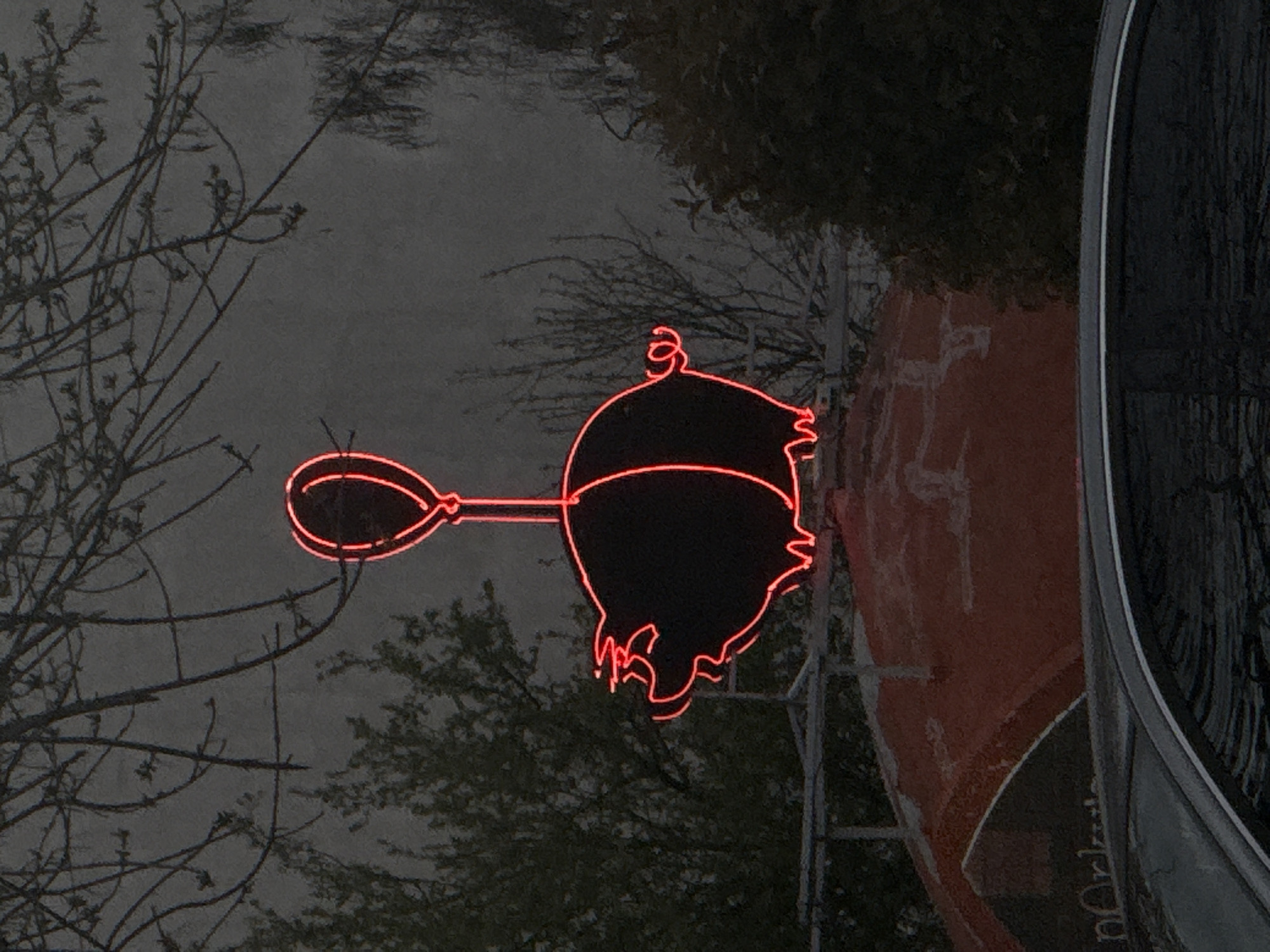 Neon pig balloon sign spotted on Plovdiv building