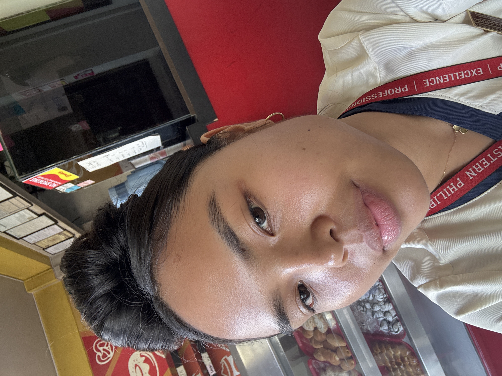 Selfie series at a Davao café, USeP lanyard in frame