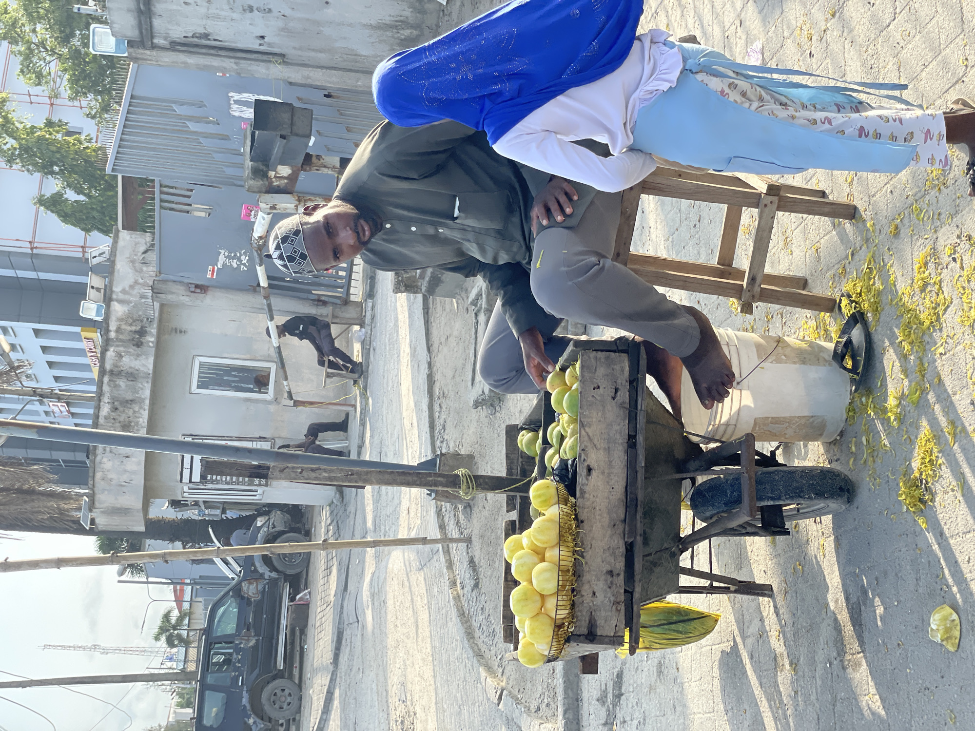 Roadside commerce and daily movement along a Lekki street