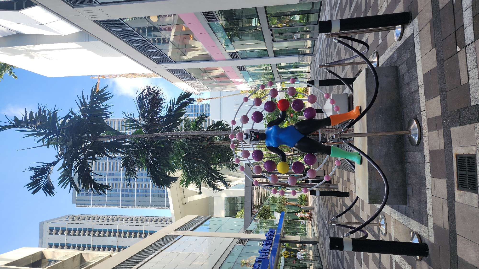 Modern suspended female figure sculpture spotted on Miami street