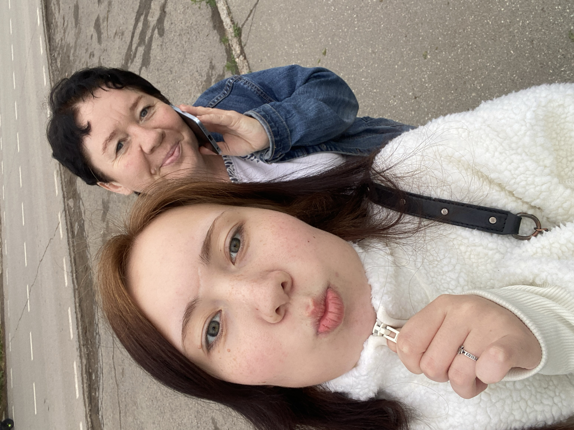Two women share casual outdoor moments, peaches spotted nearby